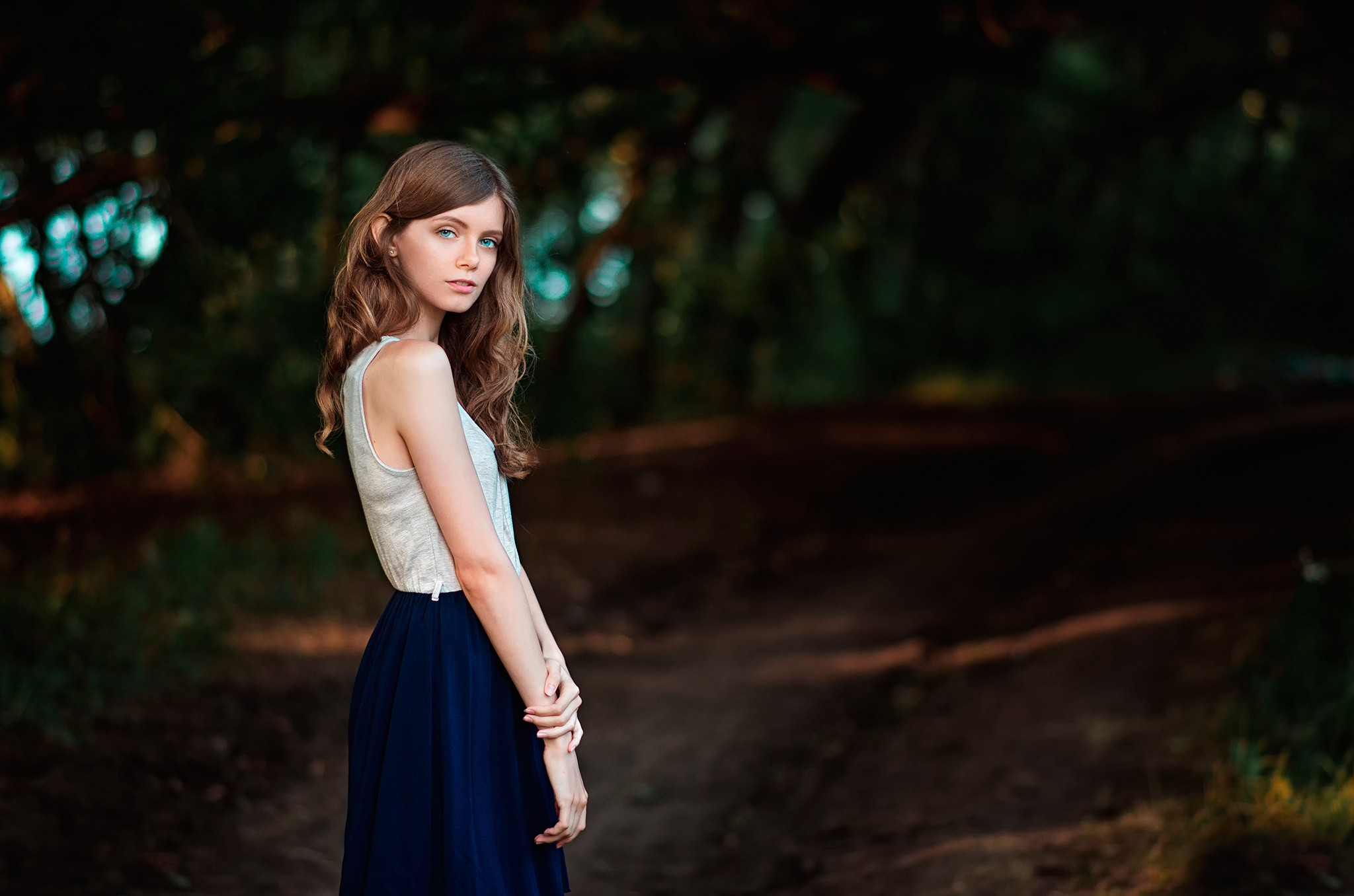 Woman with brunette hair and blue eyes in a skirt HD Wallpaper
