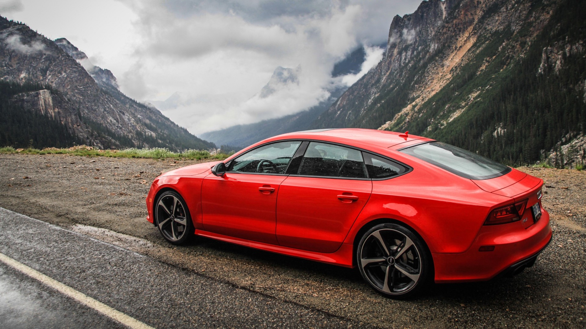 Red Audi RS7 parked on a mountain road HD Wallpaper
