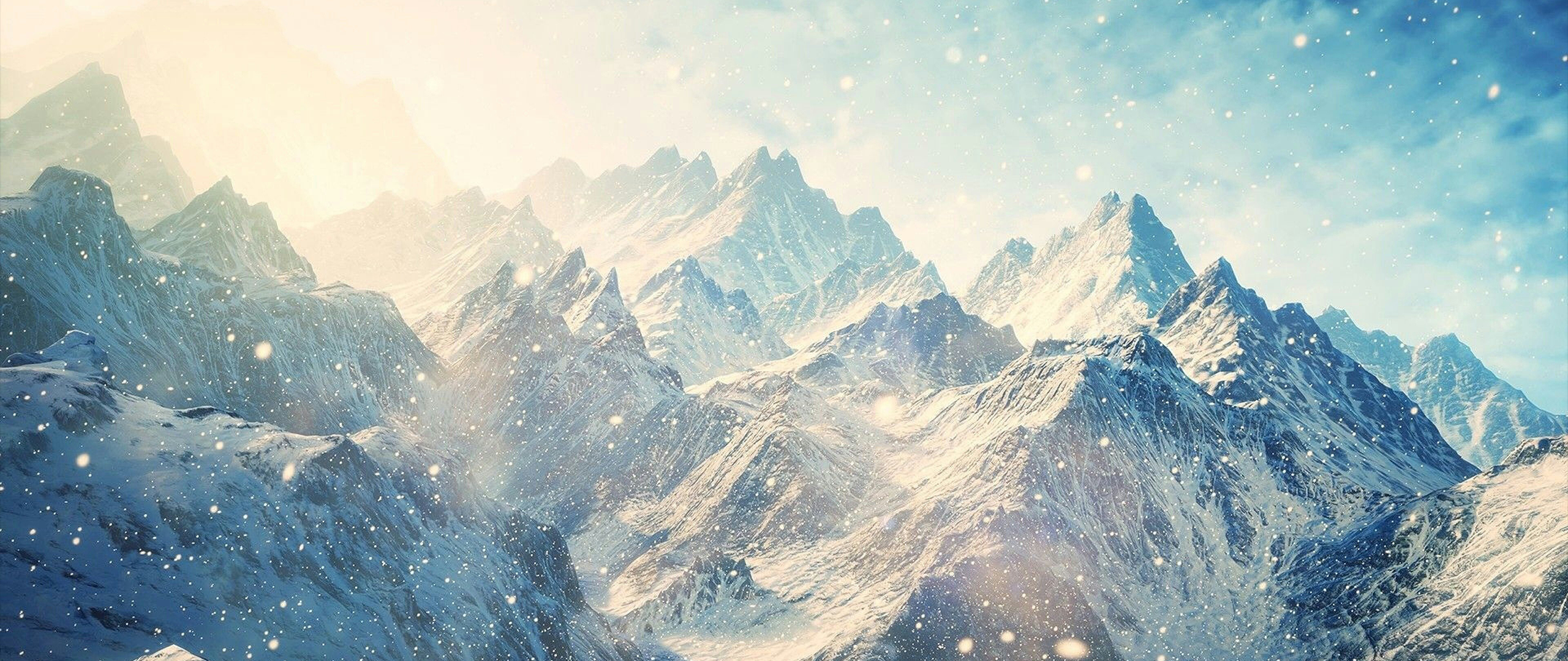Snowy mountain range with falling snow HD Wallpaper