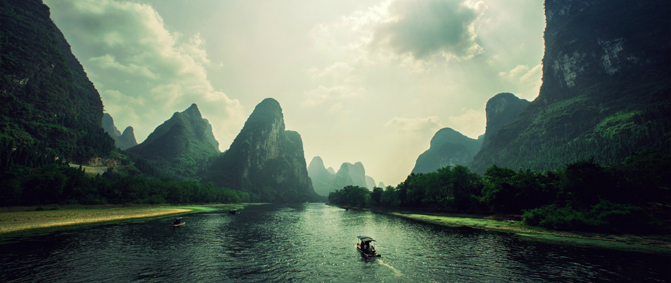Karst mountains and river with boats HD Wallpaper