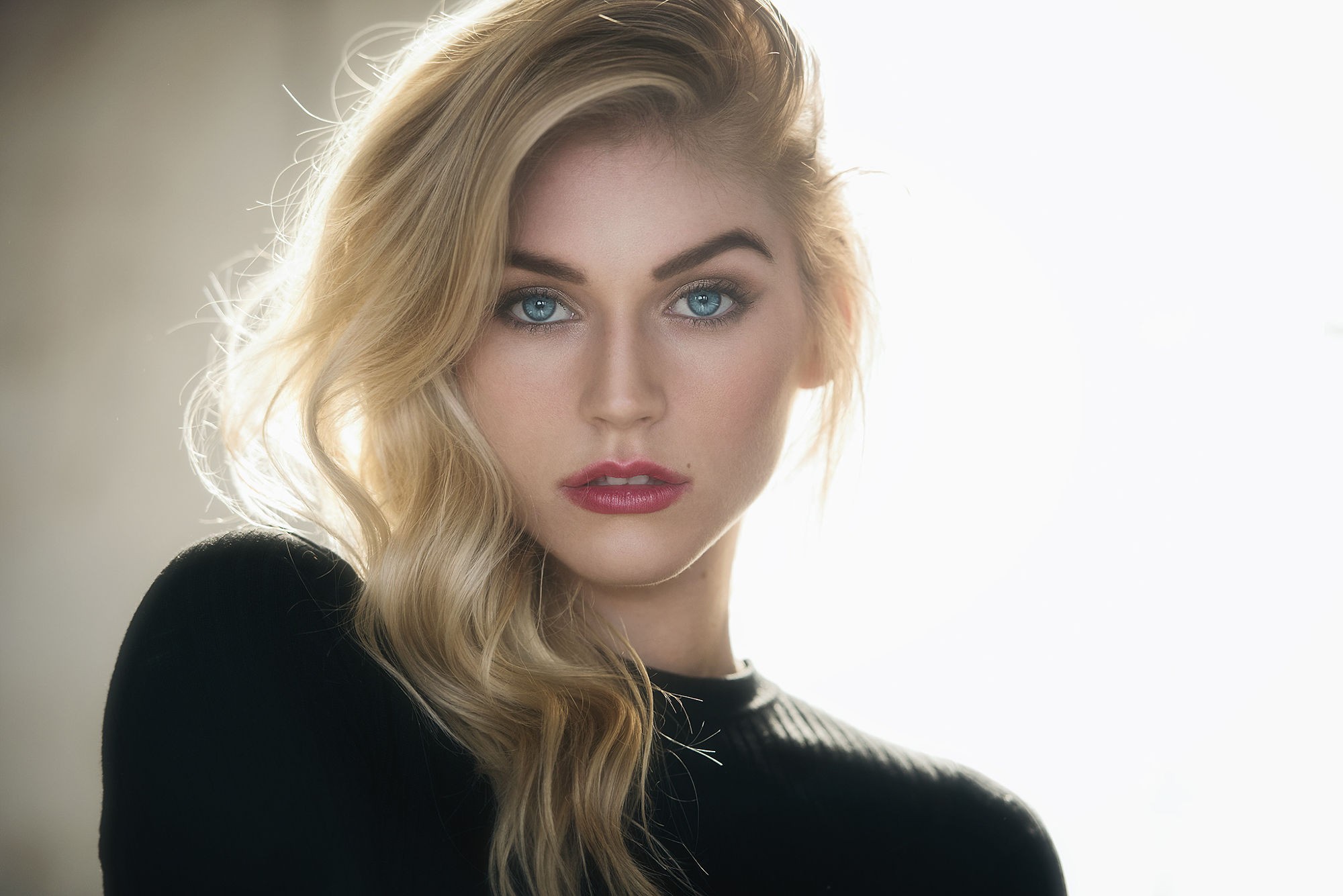 Woman with blonde hair wearing a black sweater HD Wallpaper