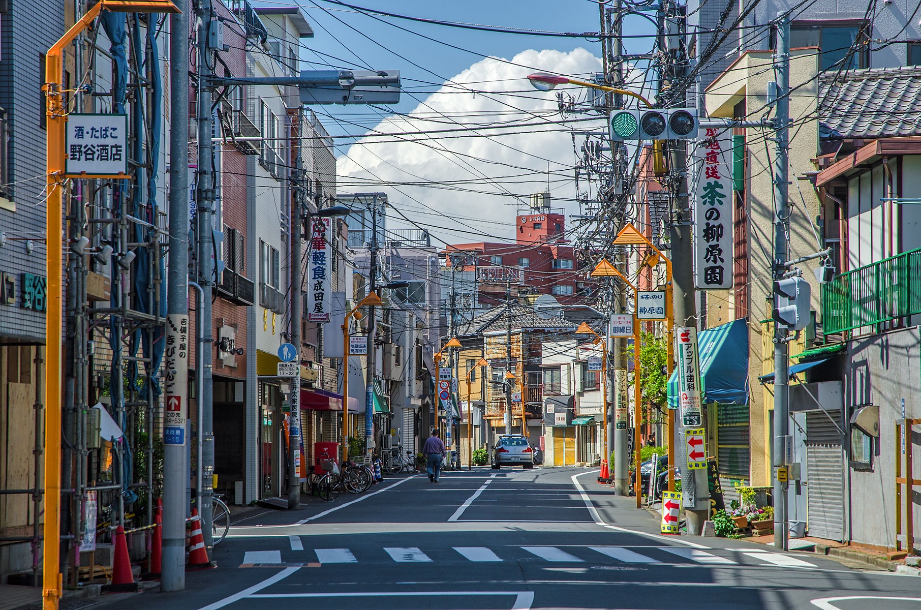 Street scene in Tokyo with shops and overhead wires HD Wallpaper
