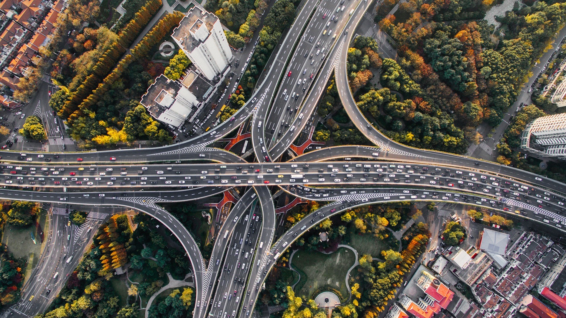 Aerial view of a busy highway interchange in Shanghai HD Wallpaper