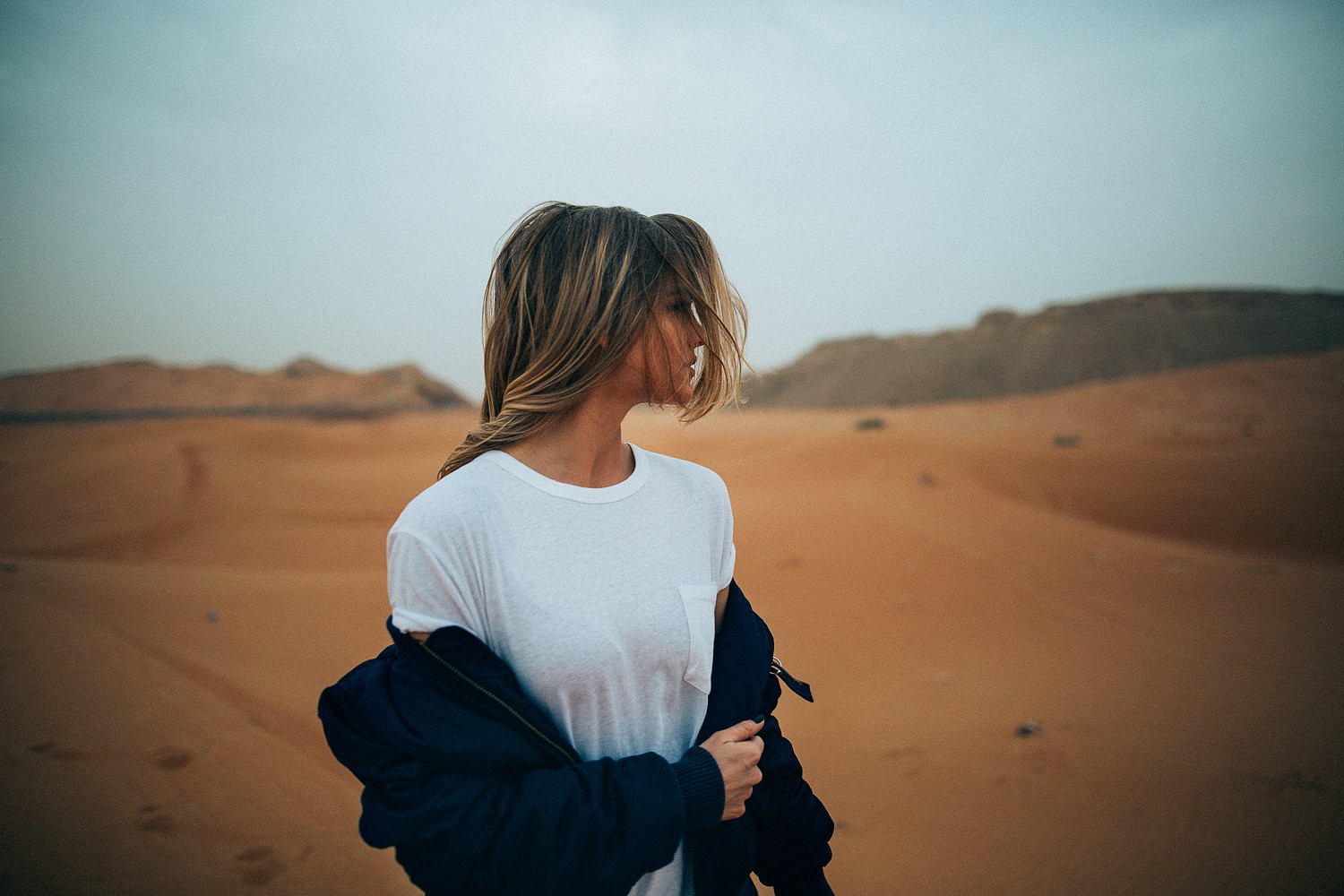 Woman in white t-shirt in the desert HD Wallpaper