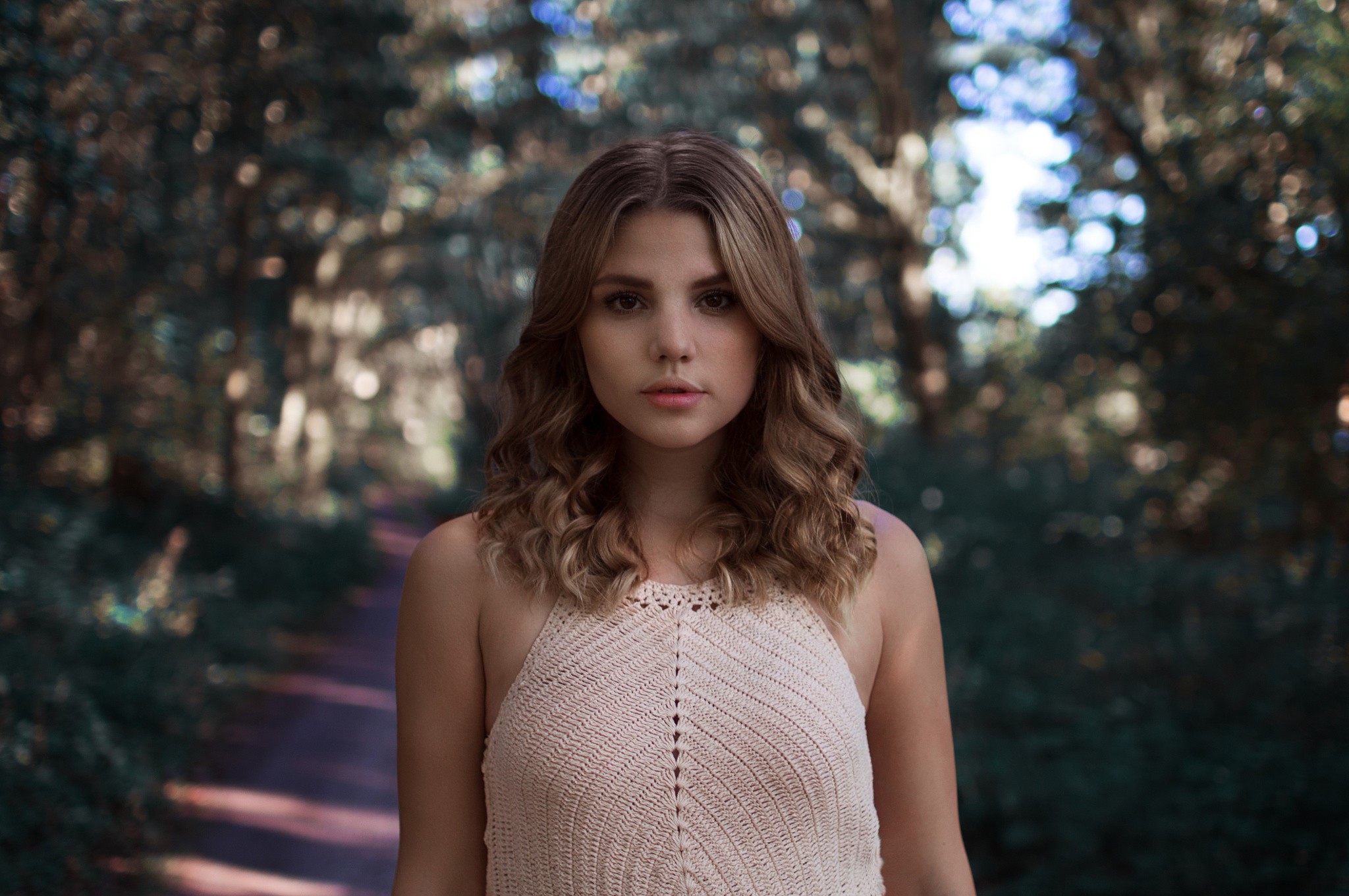 Woman in a knitted top in a forest HD Wallpaper
