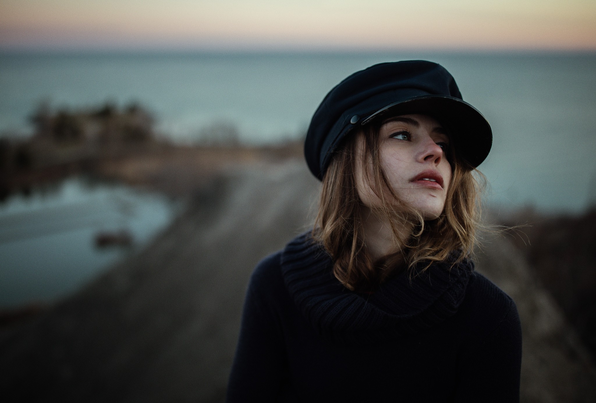 Woman wearing a black hat and sweater outdoors HD Wallpaper