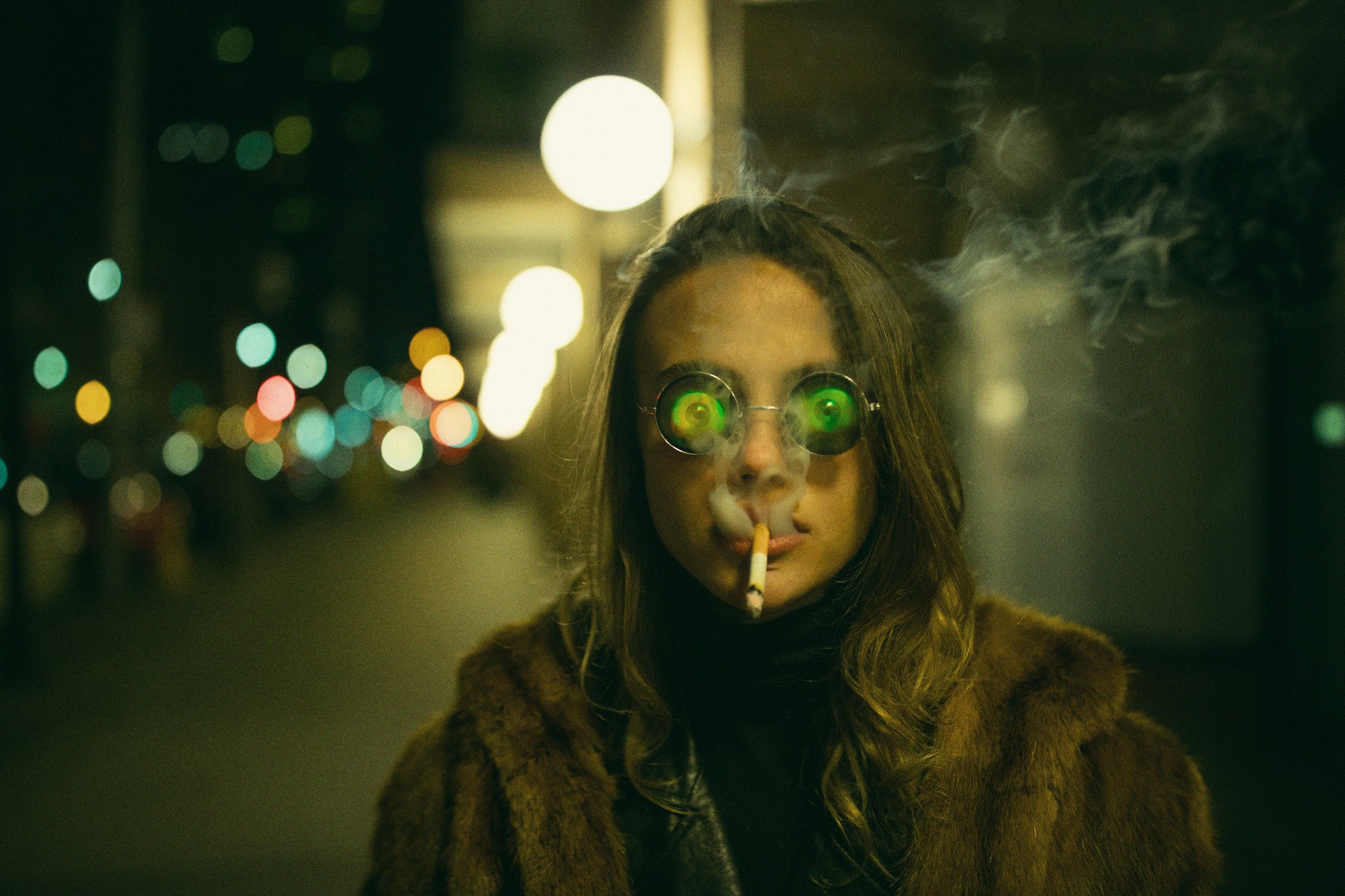 Woman wearing hologram glasses smoking a cigarette at night HD Wallpaper