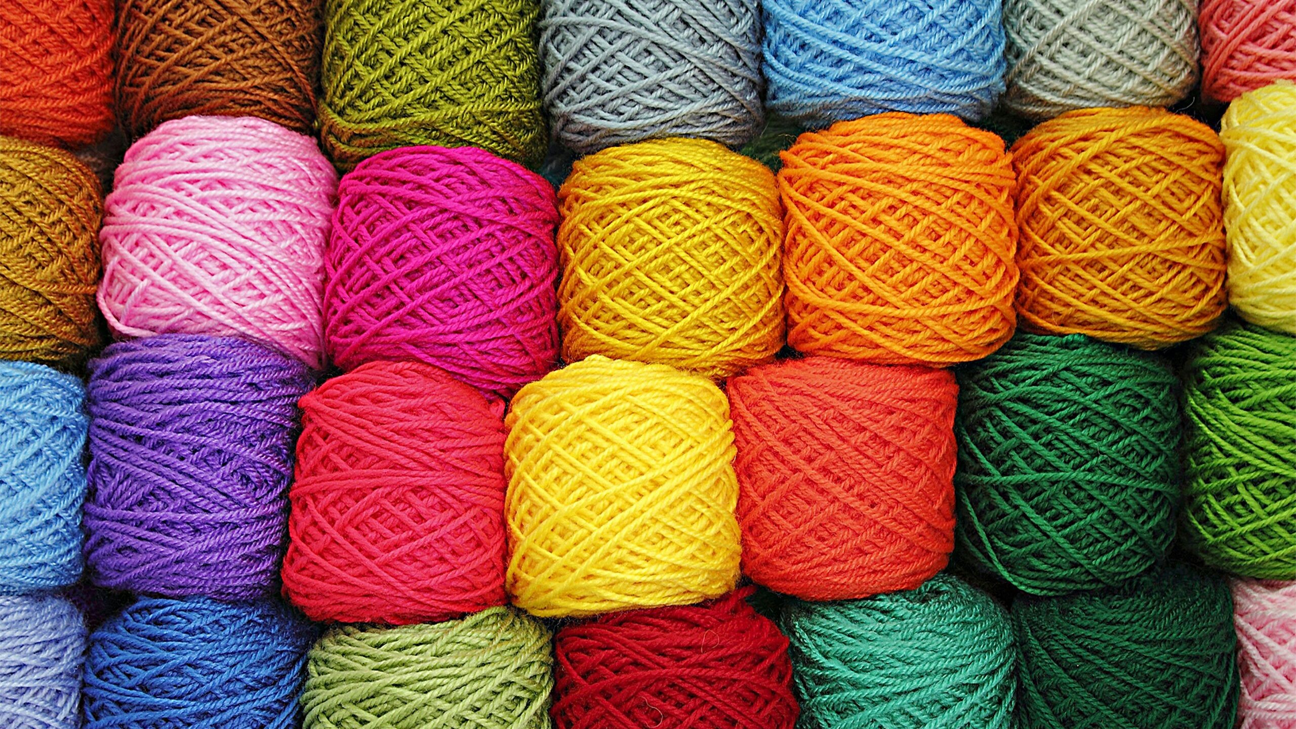 Colorful yarn balls in a grid pattern HD Wallpaper