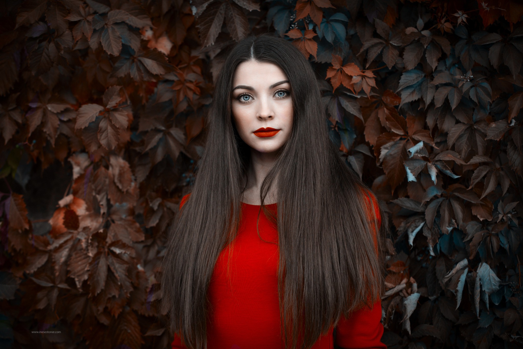 Portrait of Inese Stoner with long dark hair and red lipstick HD Wallpaper