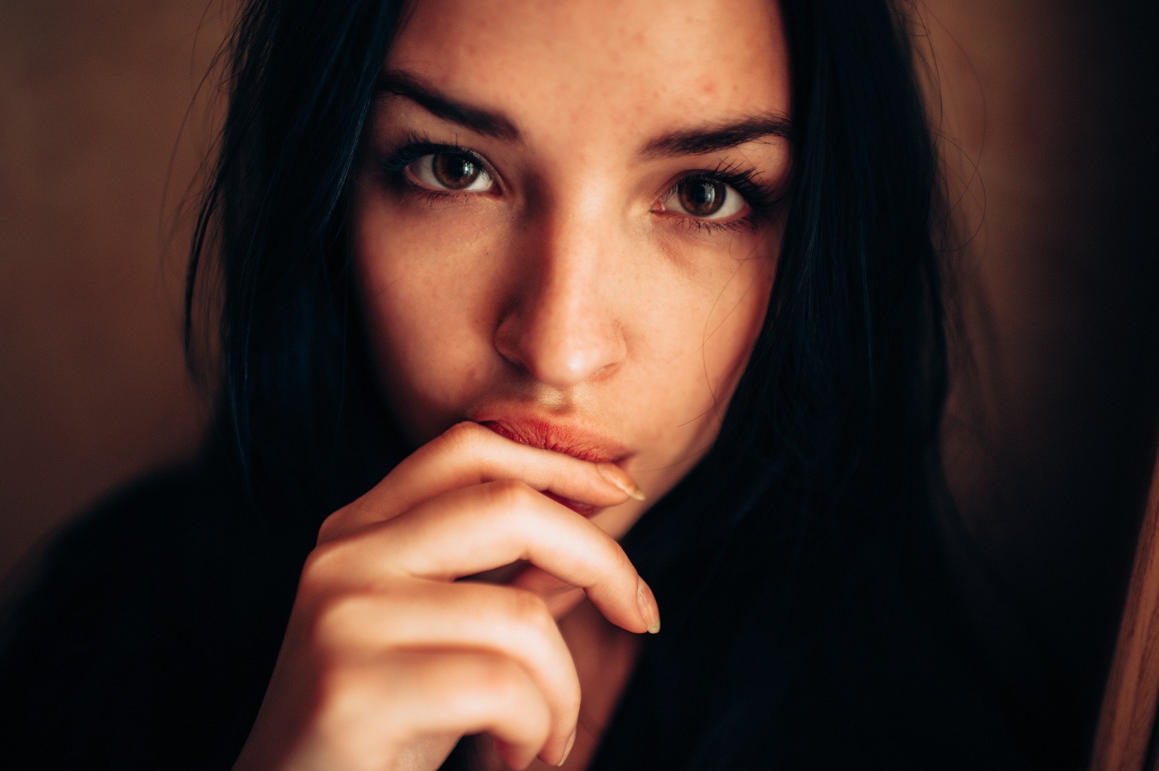 Woman with finger on lips, black hair, portrait HD Wallpaper