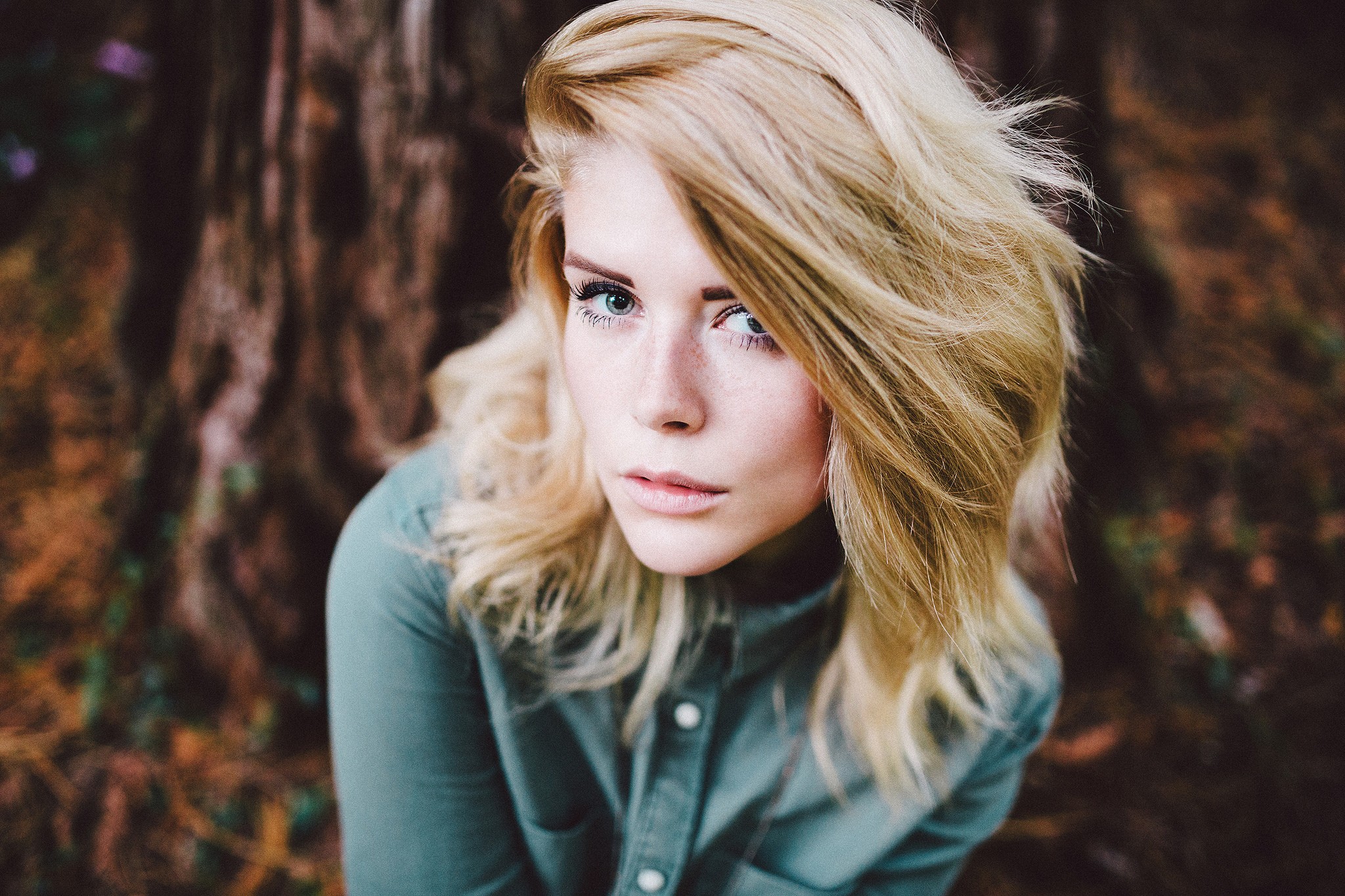 Woman with blonde hair and blue eyes outdoors HD Wallpaper
