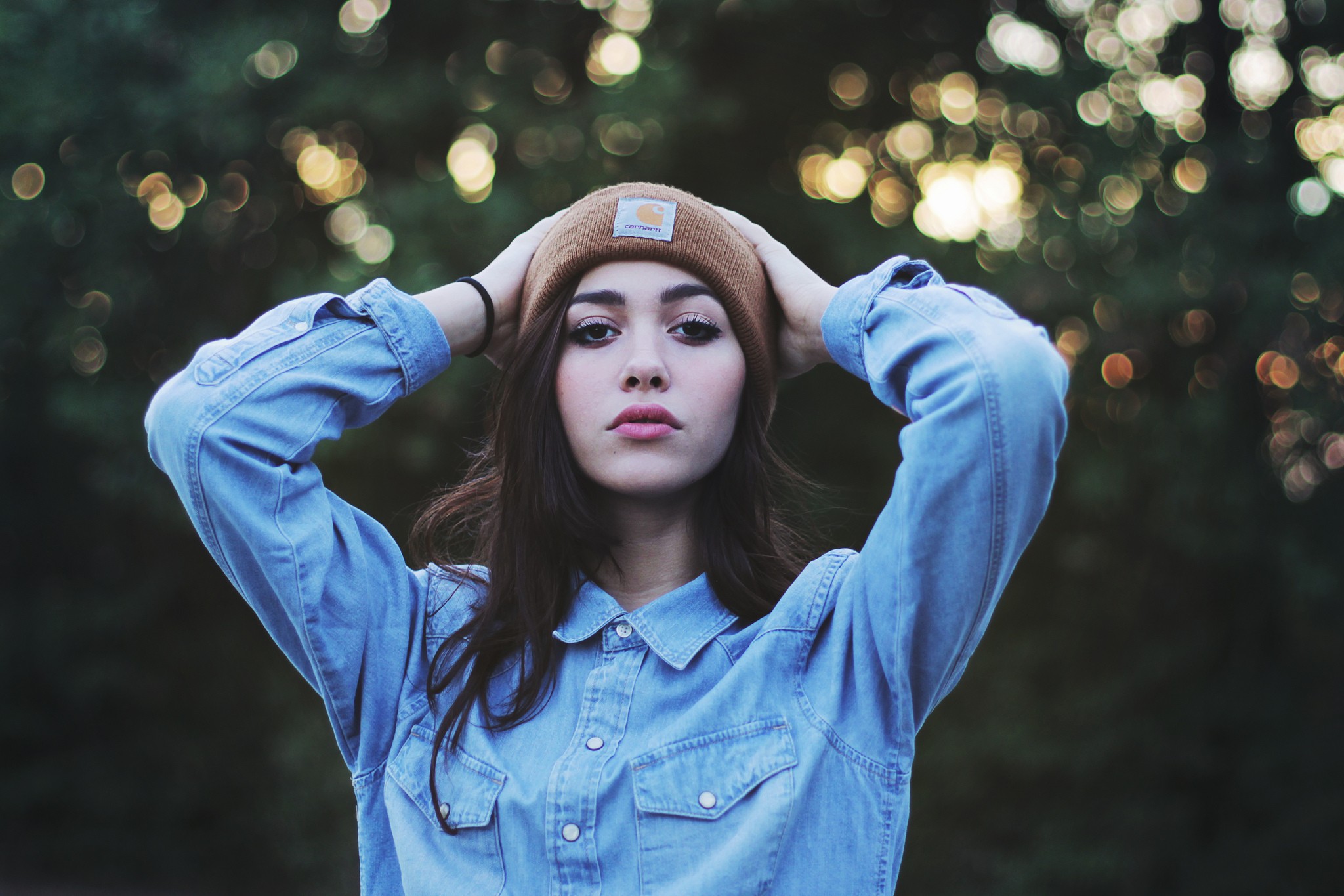 Woman wearing a Carhartt beanie and denim shirt HD Wallpaper