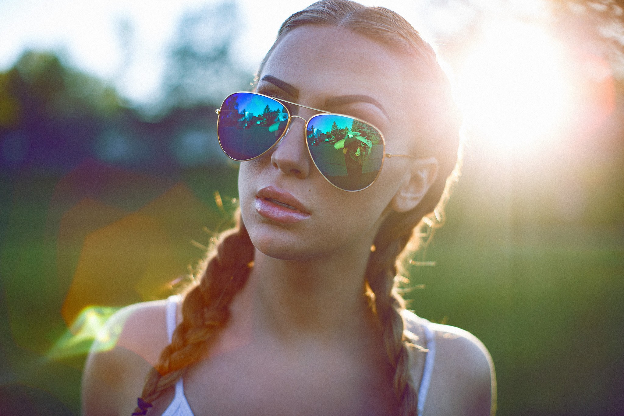 Woman with sunglasses and pigtails in sunlight HD Wallpaper