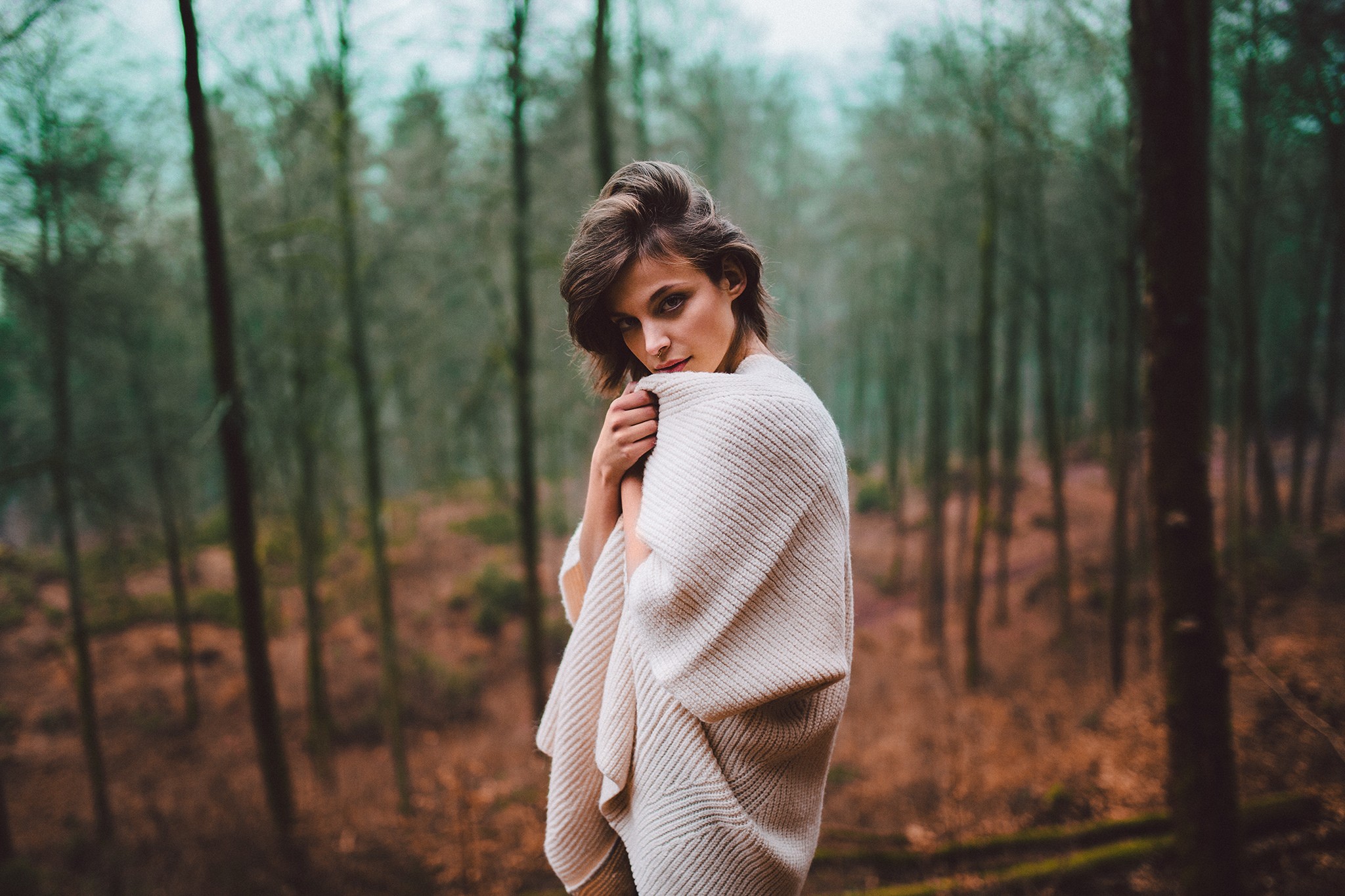Woman in a knitted shawl in a forest HD Wallpaper