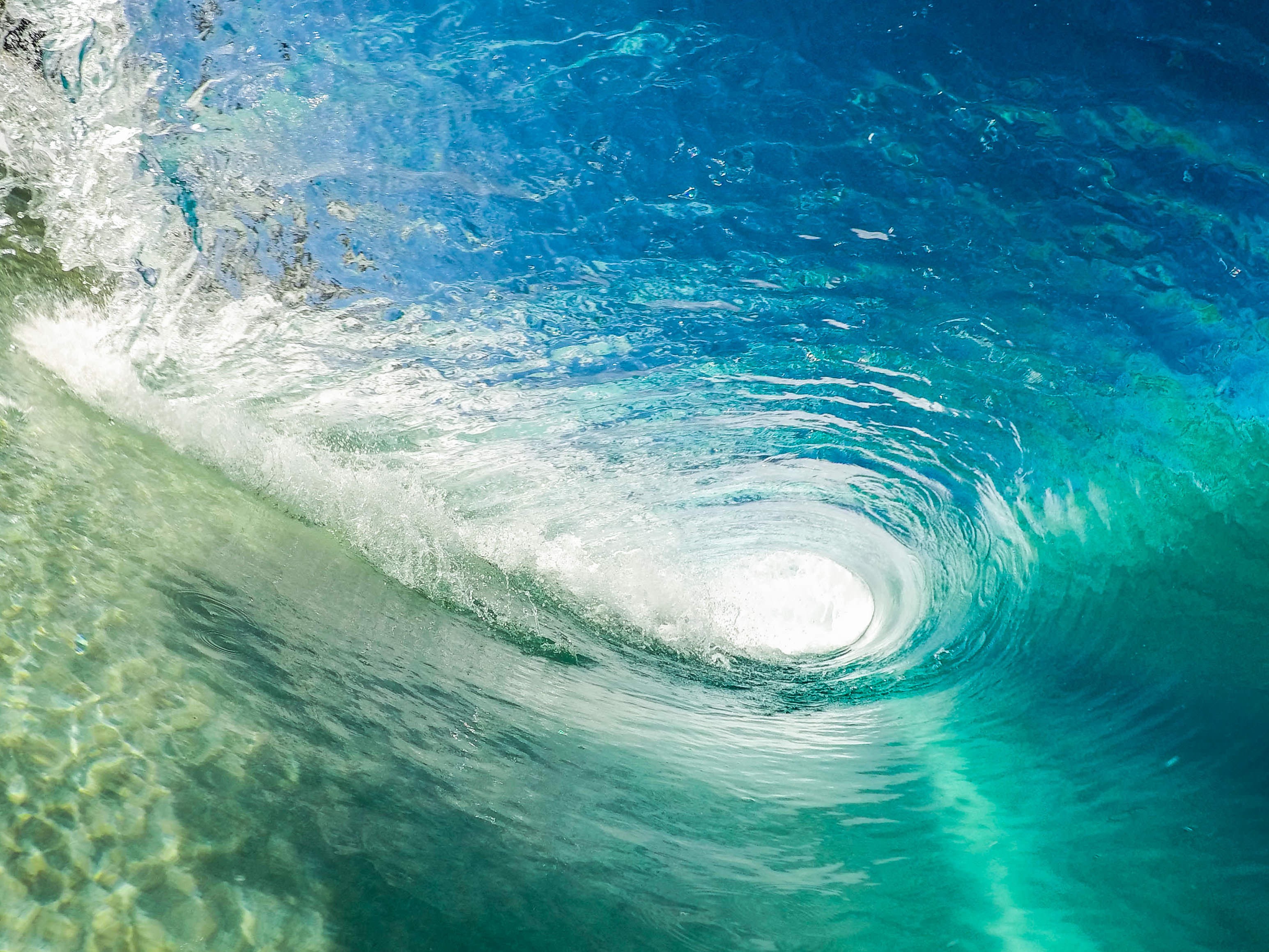 Underwater view of a breaking ocean wave HD Wallpaper