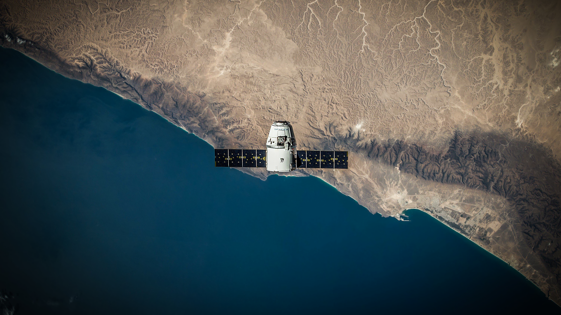 SpaceX Dragon spacecraft orbiting Earth HD Wallpaper