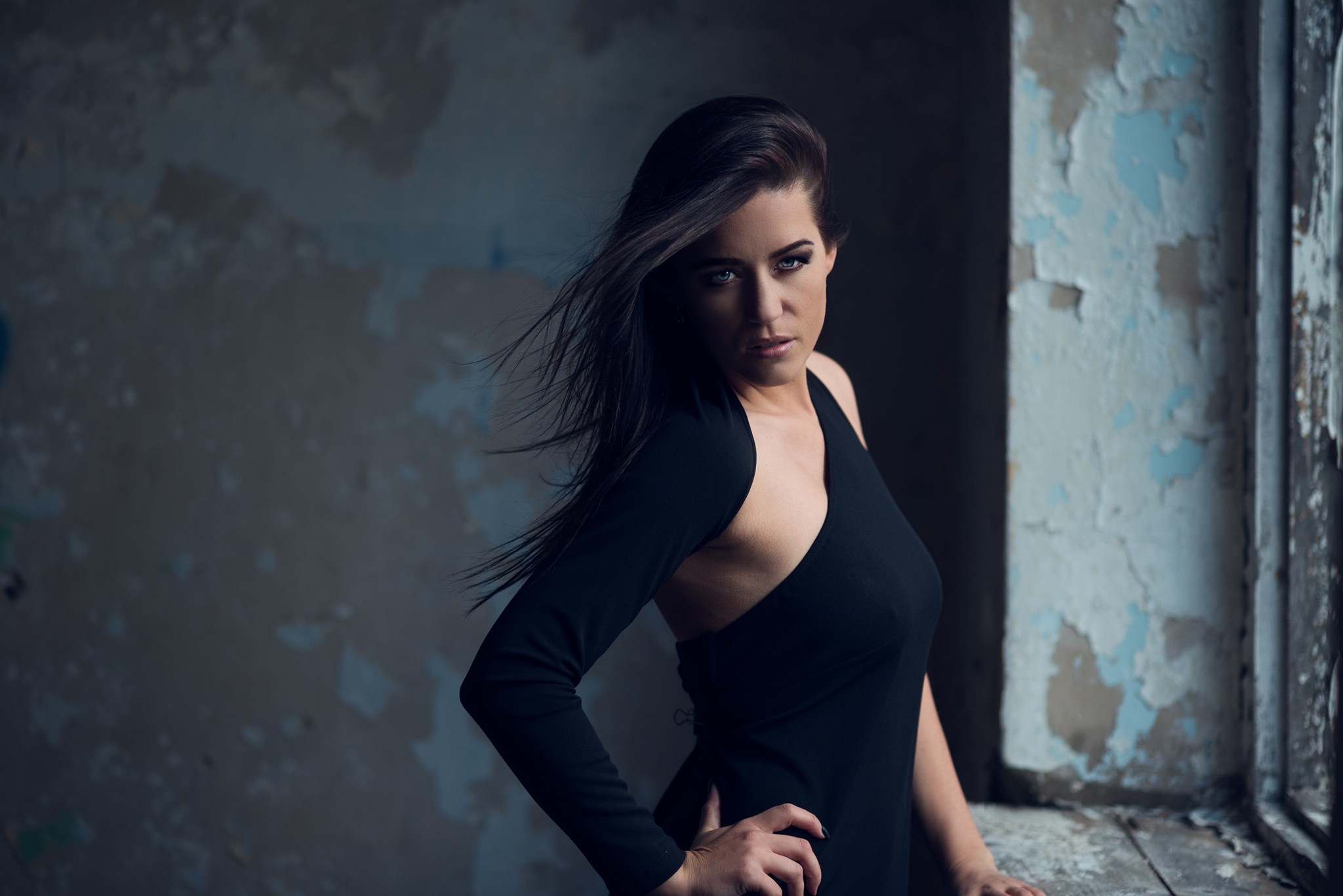 Woman in black dress in urban decay setting HD Wallpaper