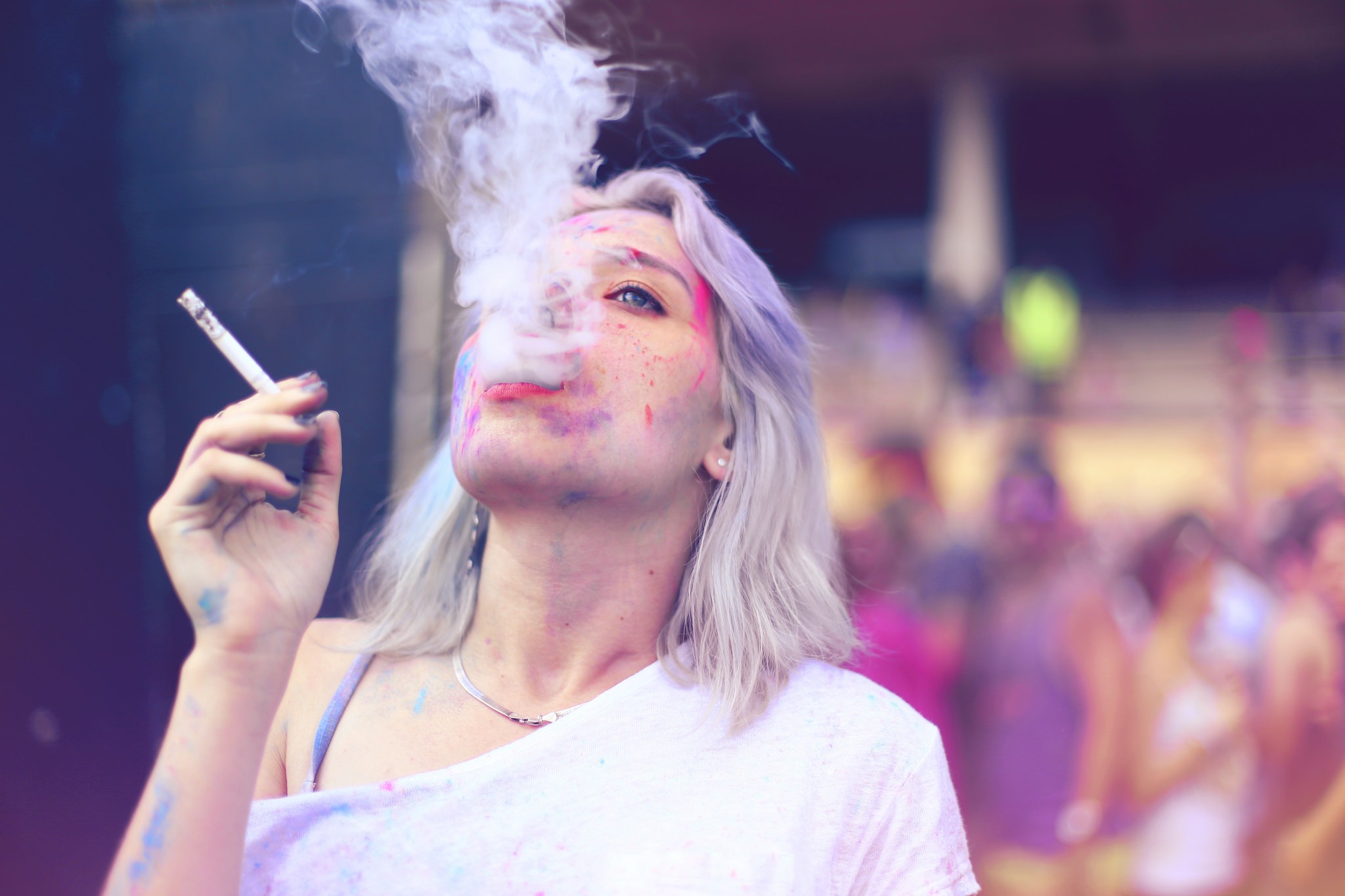 Woman smoking at Holi festival HD Wallpaper