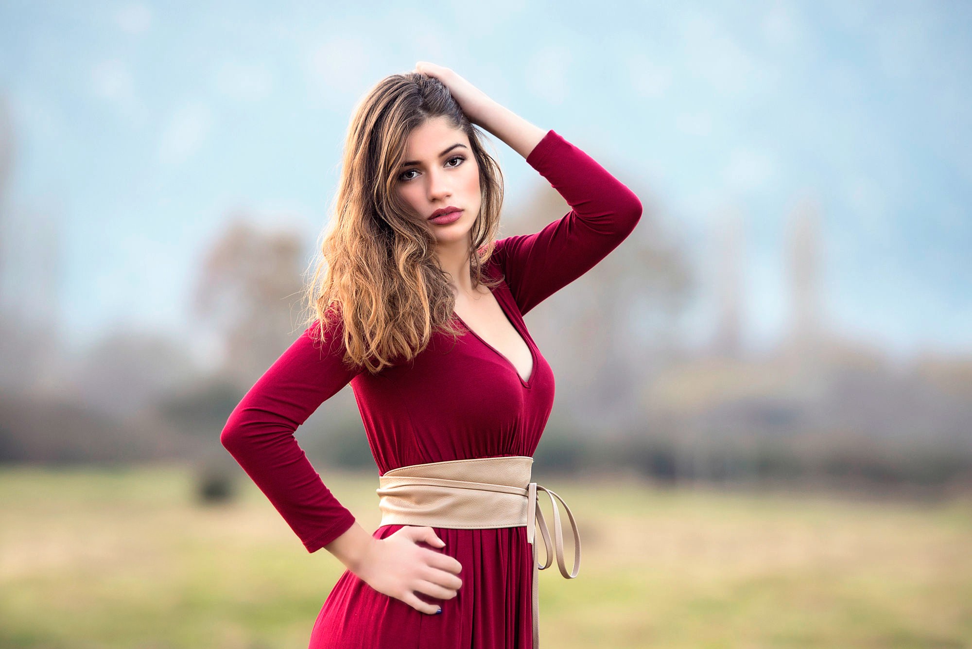 Woman in a red dress with a sash HD Wallpaper