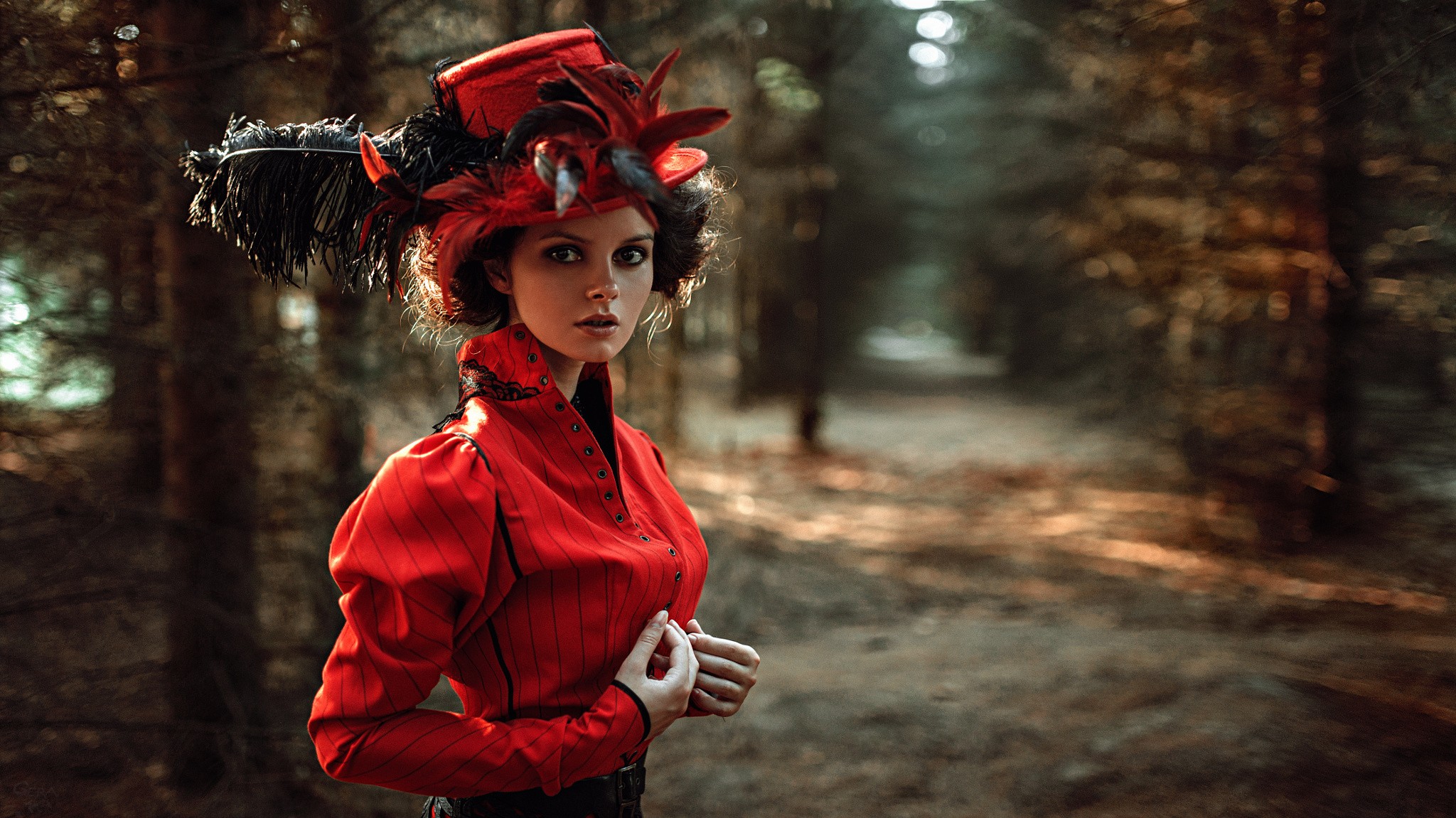 Woman in red Victorian dress and hat in forest HD Wallpaper