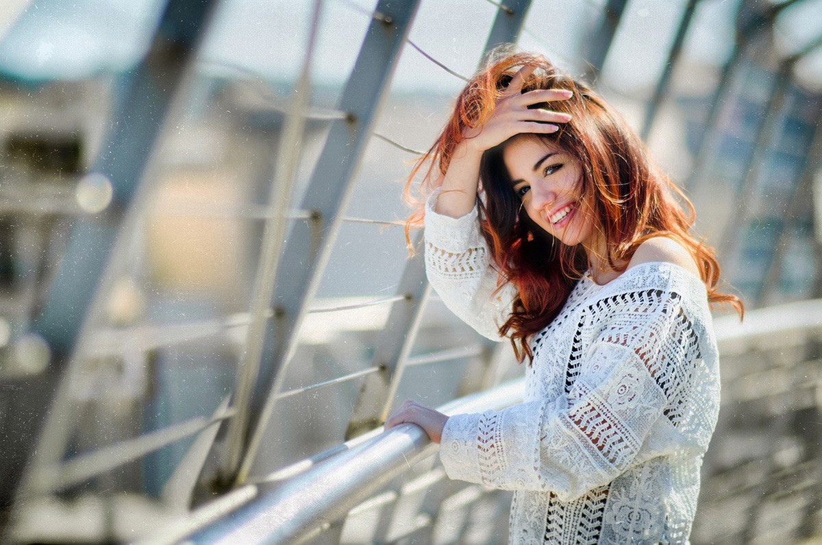 Delaia Gonzalez smiling with hand in hair HD Wallpaper
