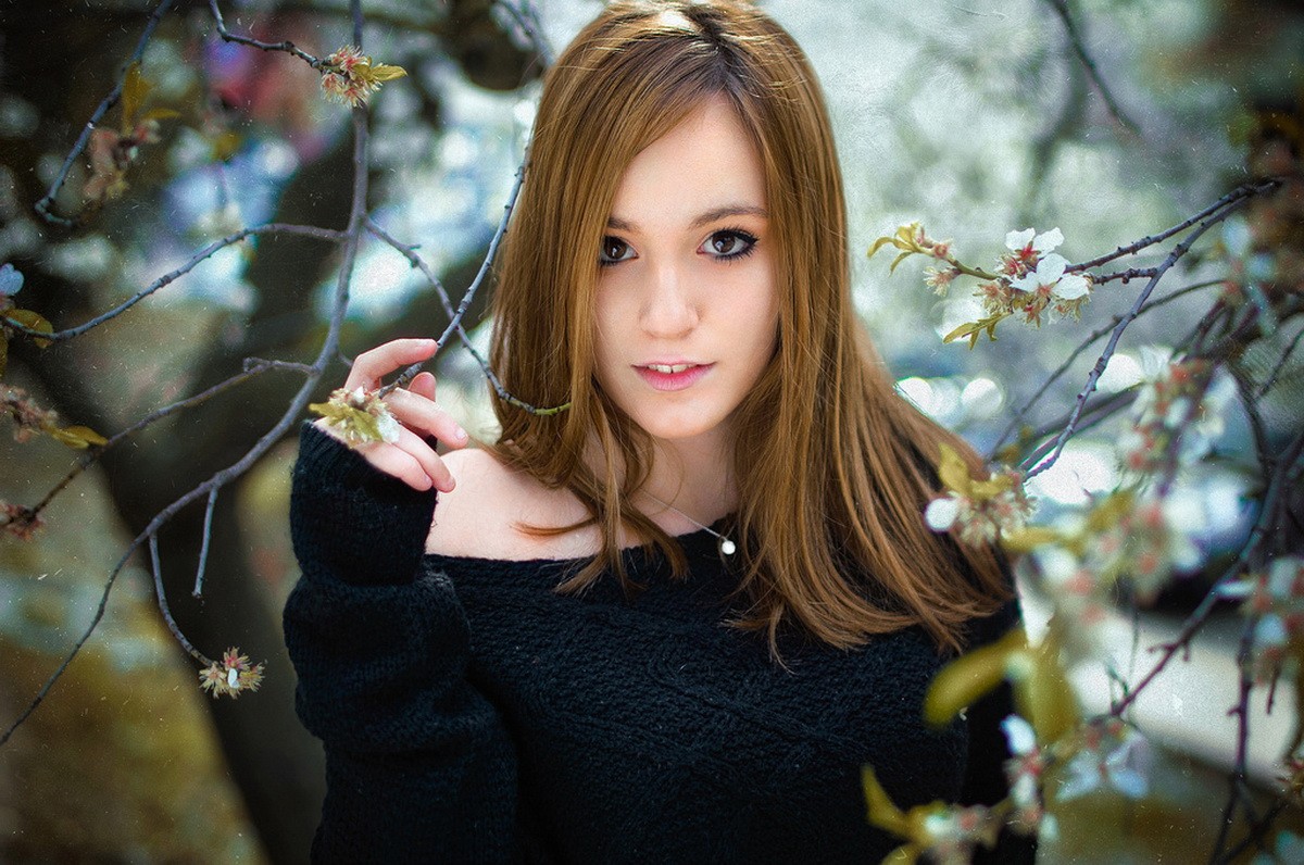 Young woman with brown hair in a black sweater HD Wallpaper