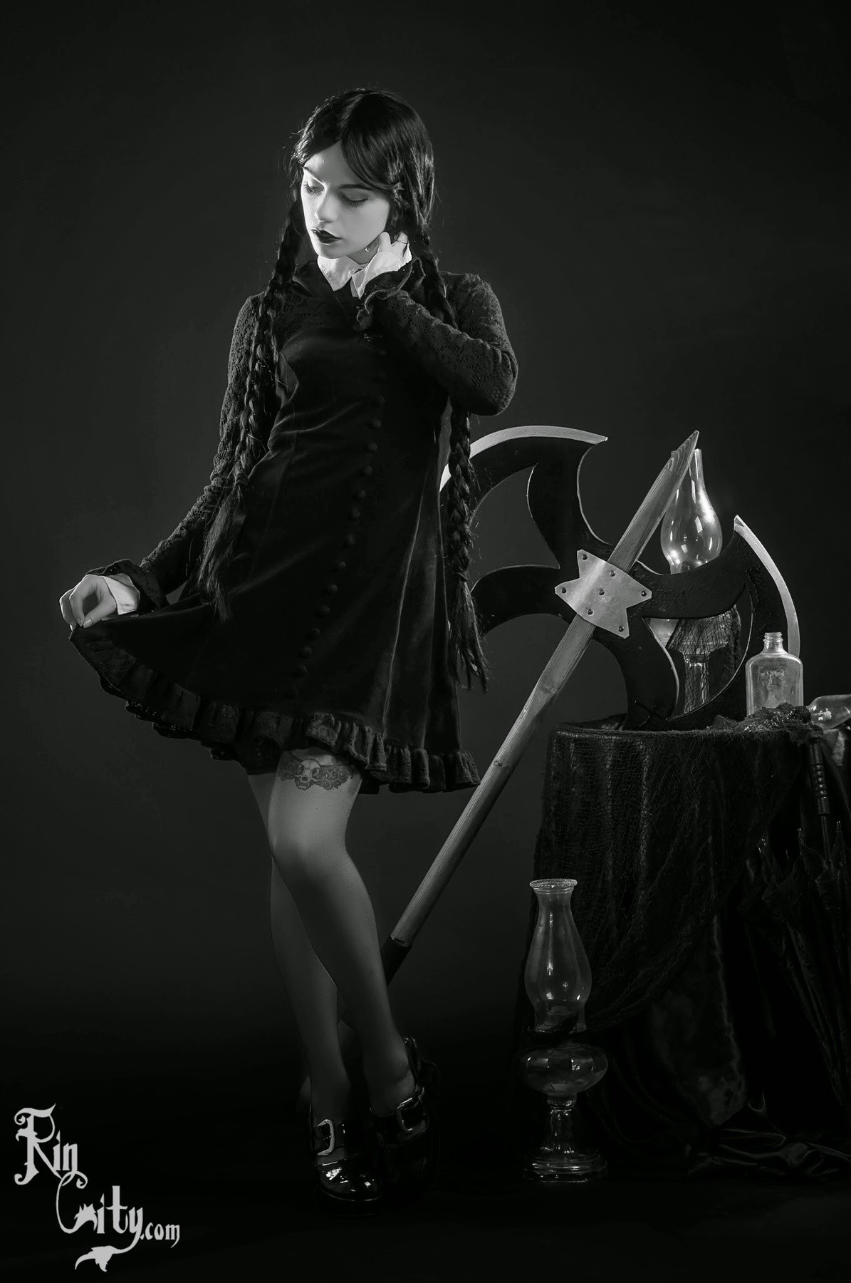 Wednesday Addams cosplay with axe and lamps HD Wallpaper