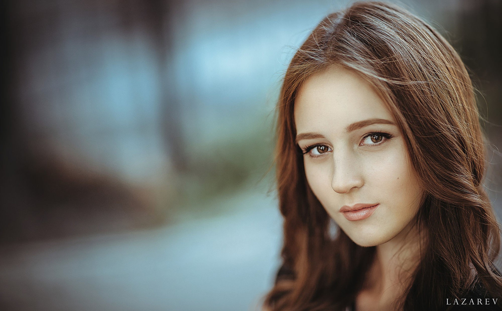 Portrait of a young woman with brown hair and eyes HD Wallpaper