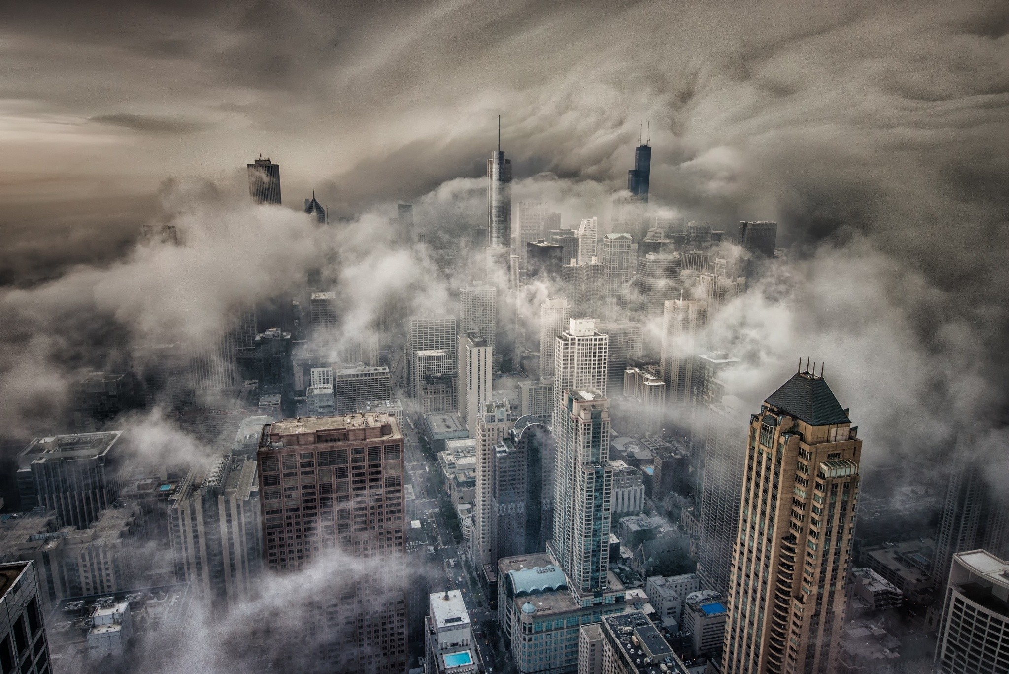 Chicago cityscape shrouded in mist and clouds HD Wallpaper