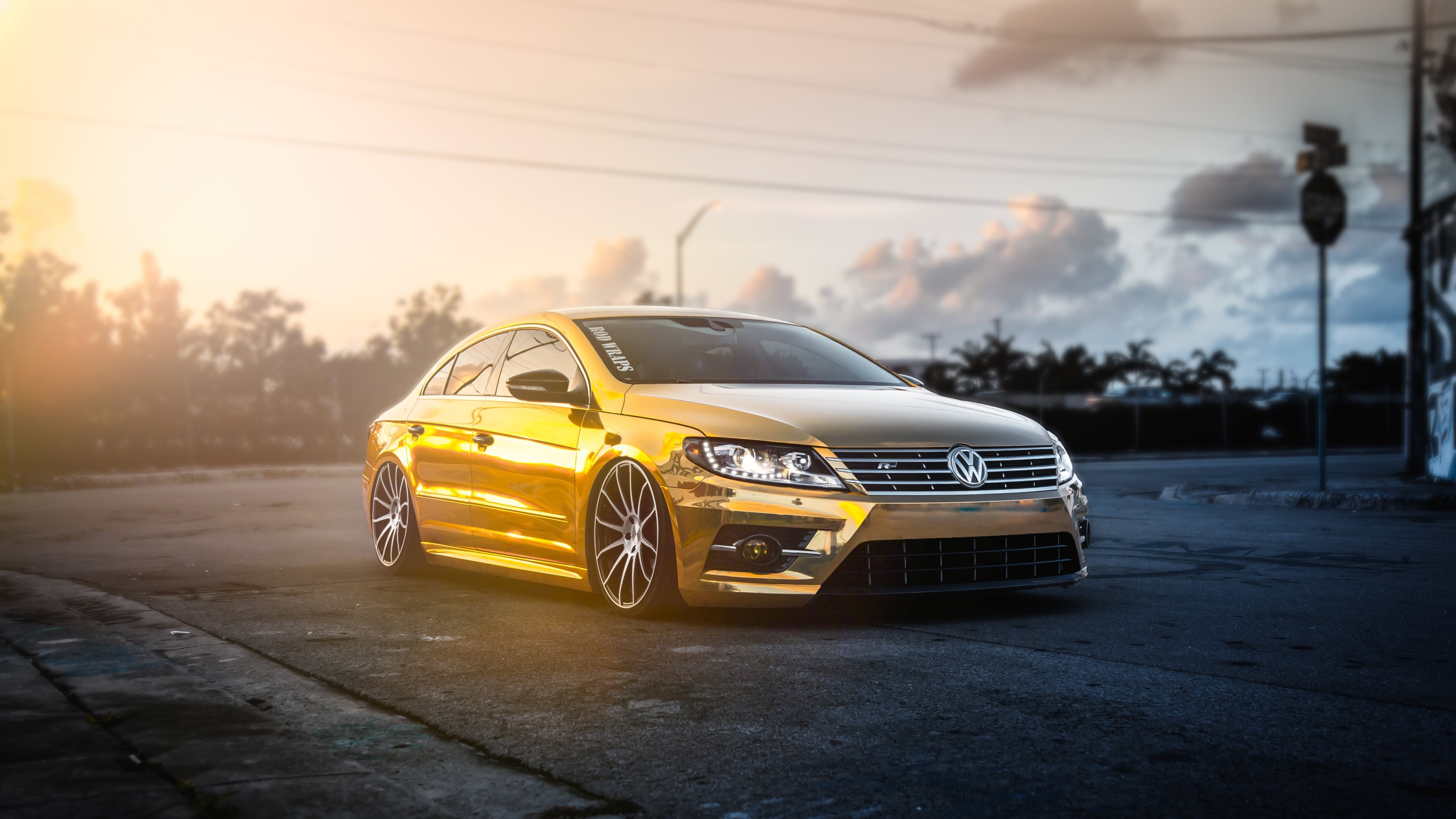 Gold Volkswagen CC parked on a street at sunset HD Wallpaper