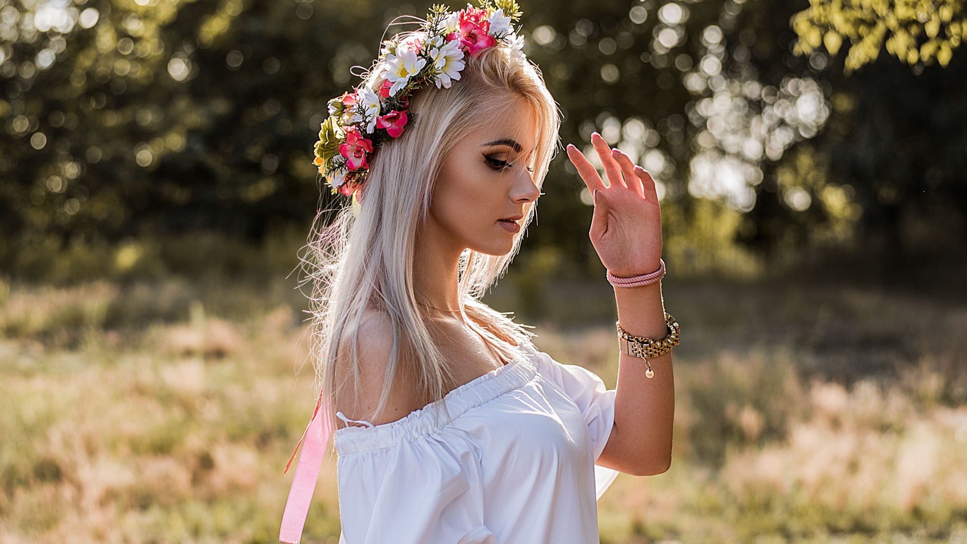 Woman with flower crown in a field HD Wallpaper