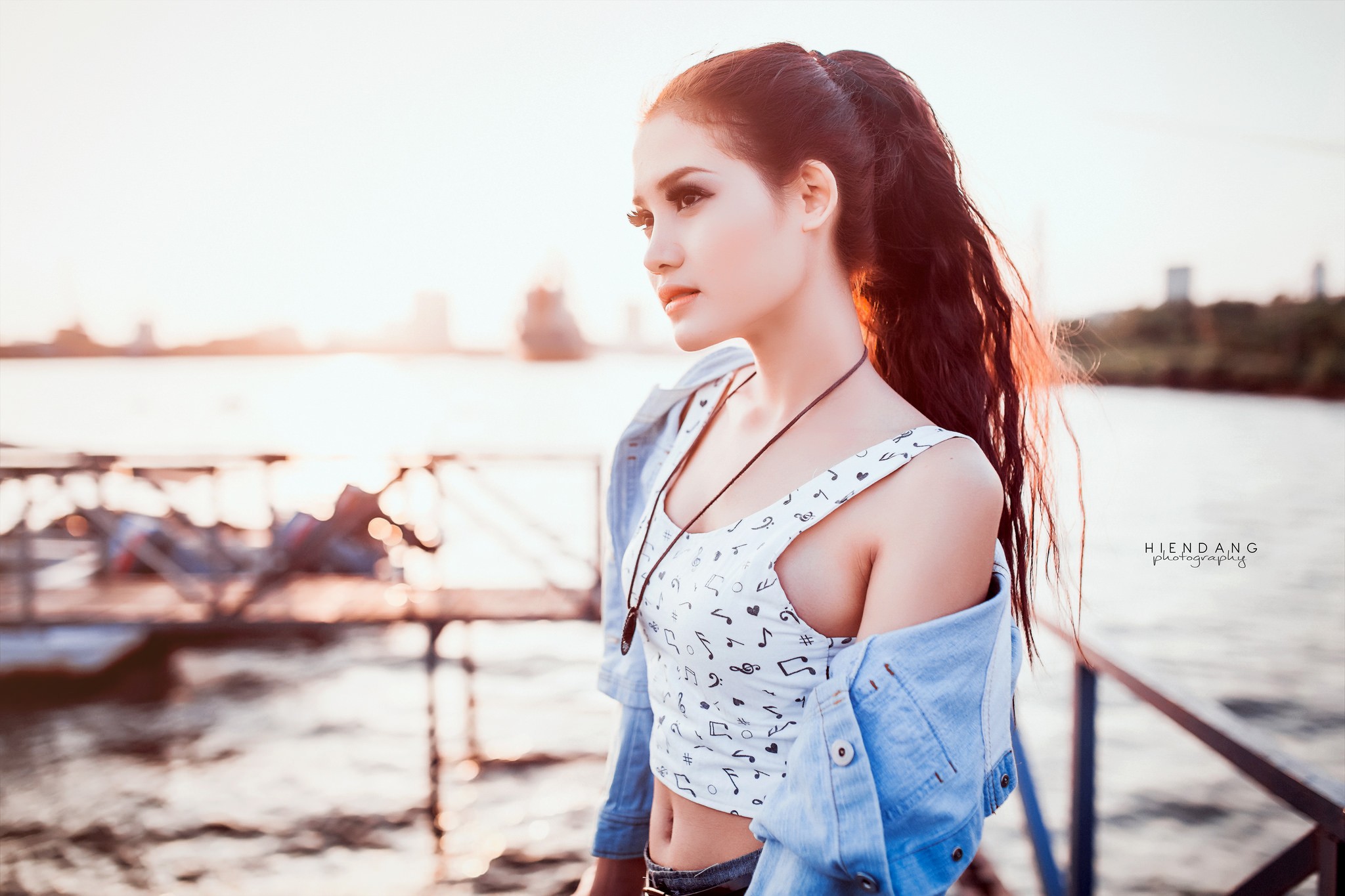 Asian woman with ponytail wearing a crop top and denim jacket HD Wallpaper