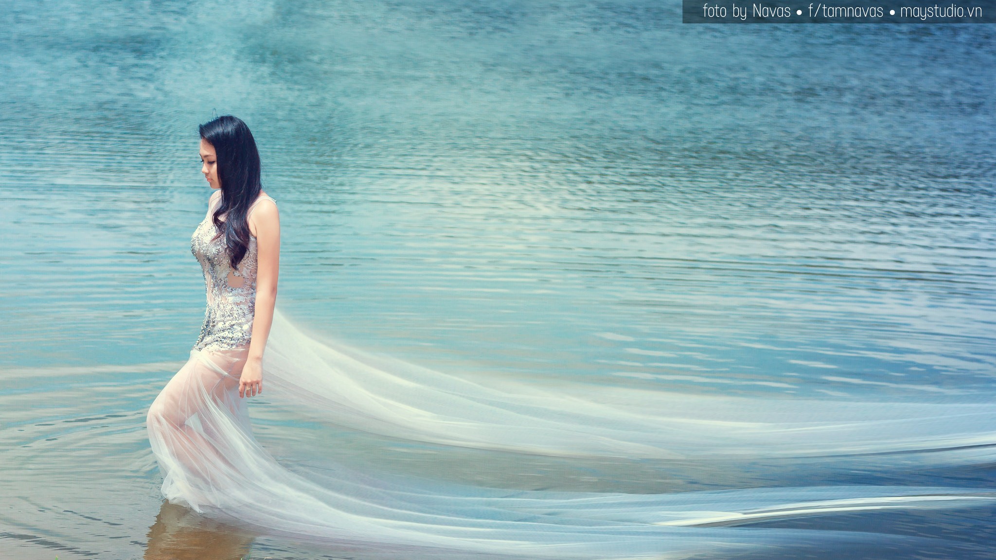 Woman in a flowing dress walking in water HD Wallpaper