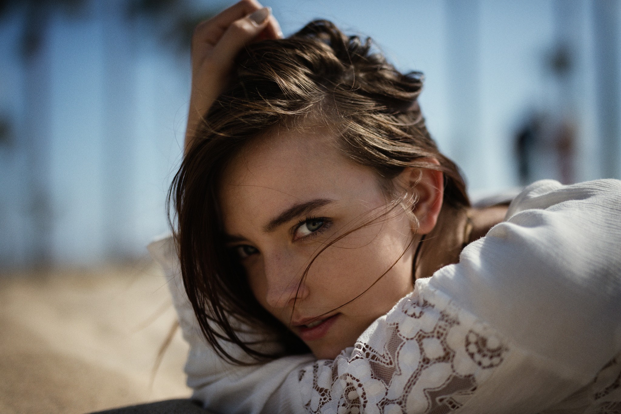 Woman with hand on head, portrait HD Wallpaper