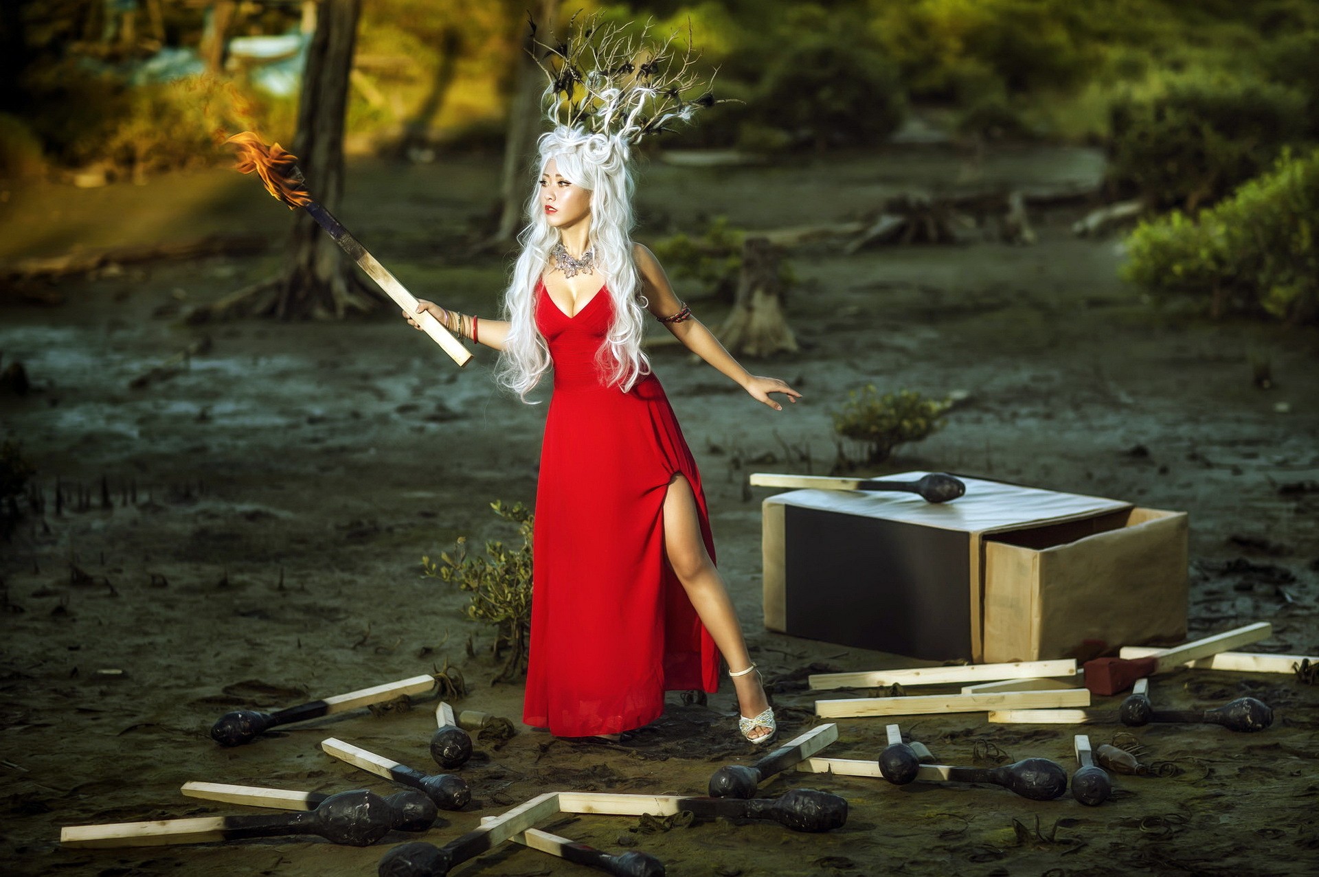 Woman in red dress holding a lit match HD Wallpaper