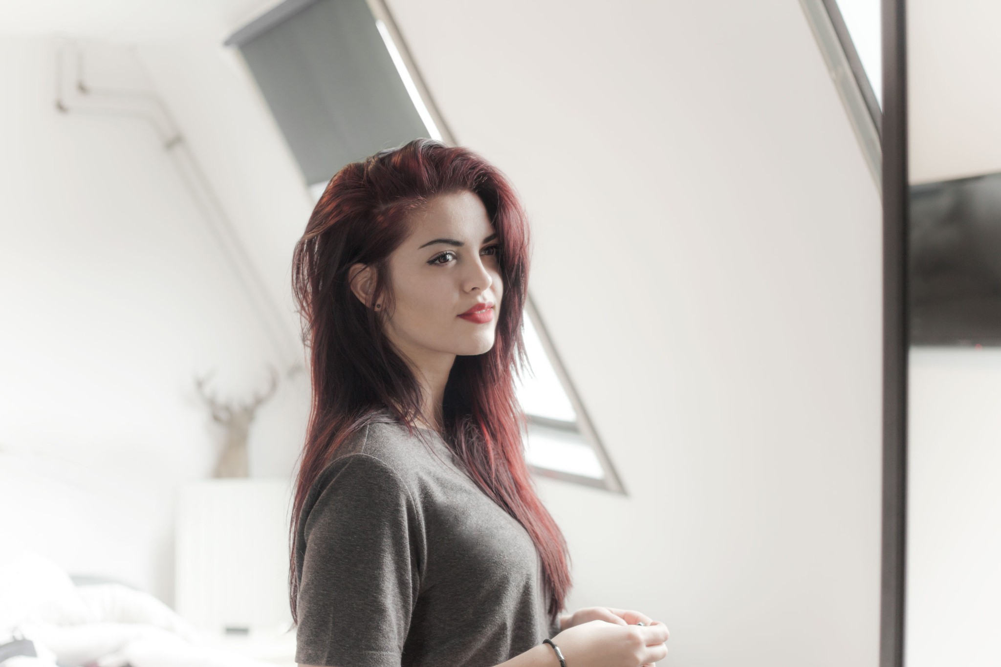 Woman with red hair and red lipstick looking away HD Wallpaper