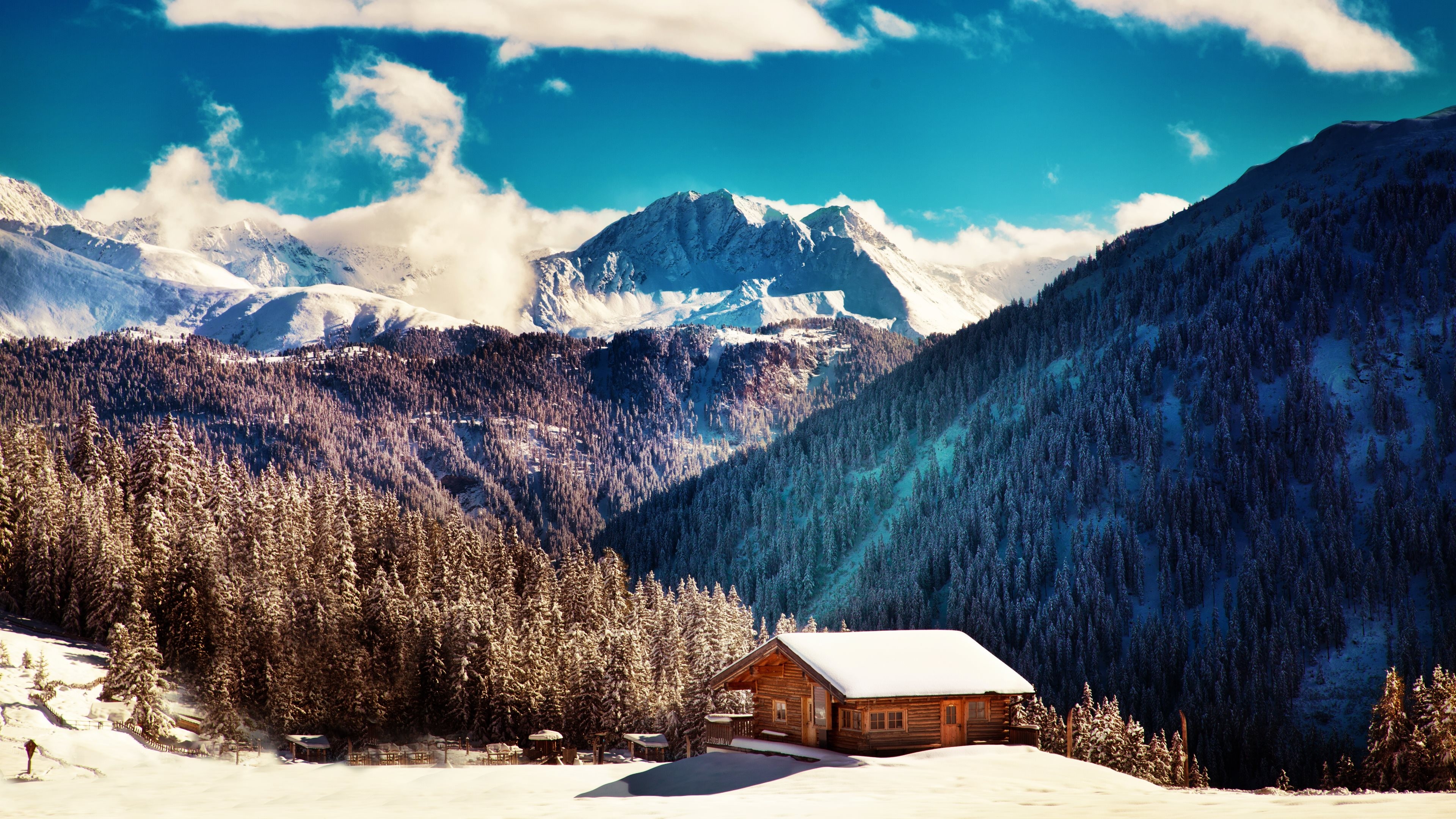 Wooden cabin in snowy mountains with pine trees HD Wallpaper