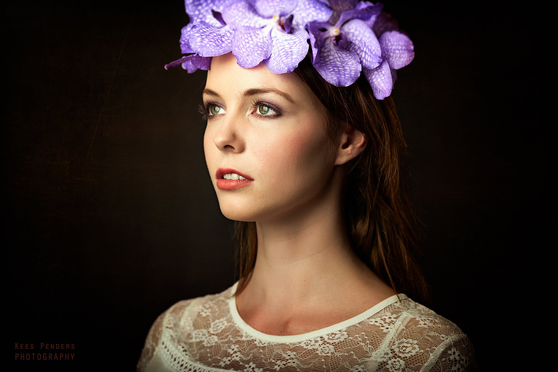 Woman with purple flowers in her hair HD Wallpaper