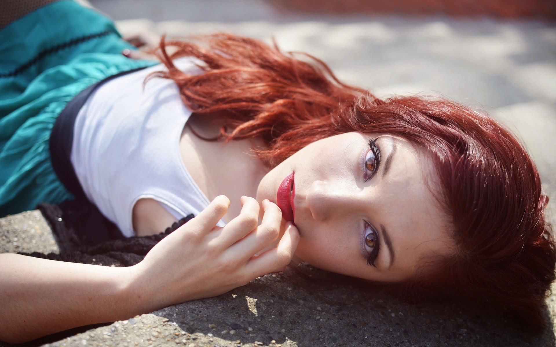 Redhead woman lying on the ground HD Wallpaper