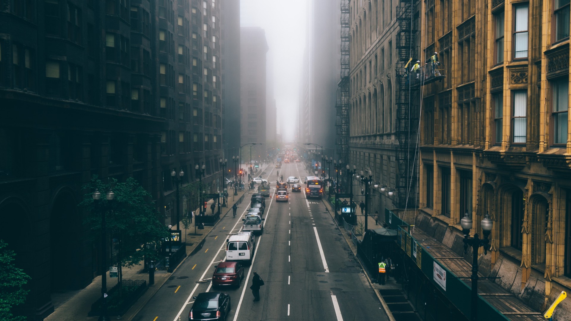 City street in fog with traffic HD Wallpaper