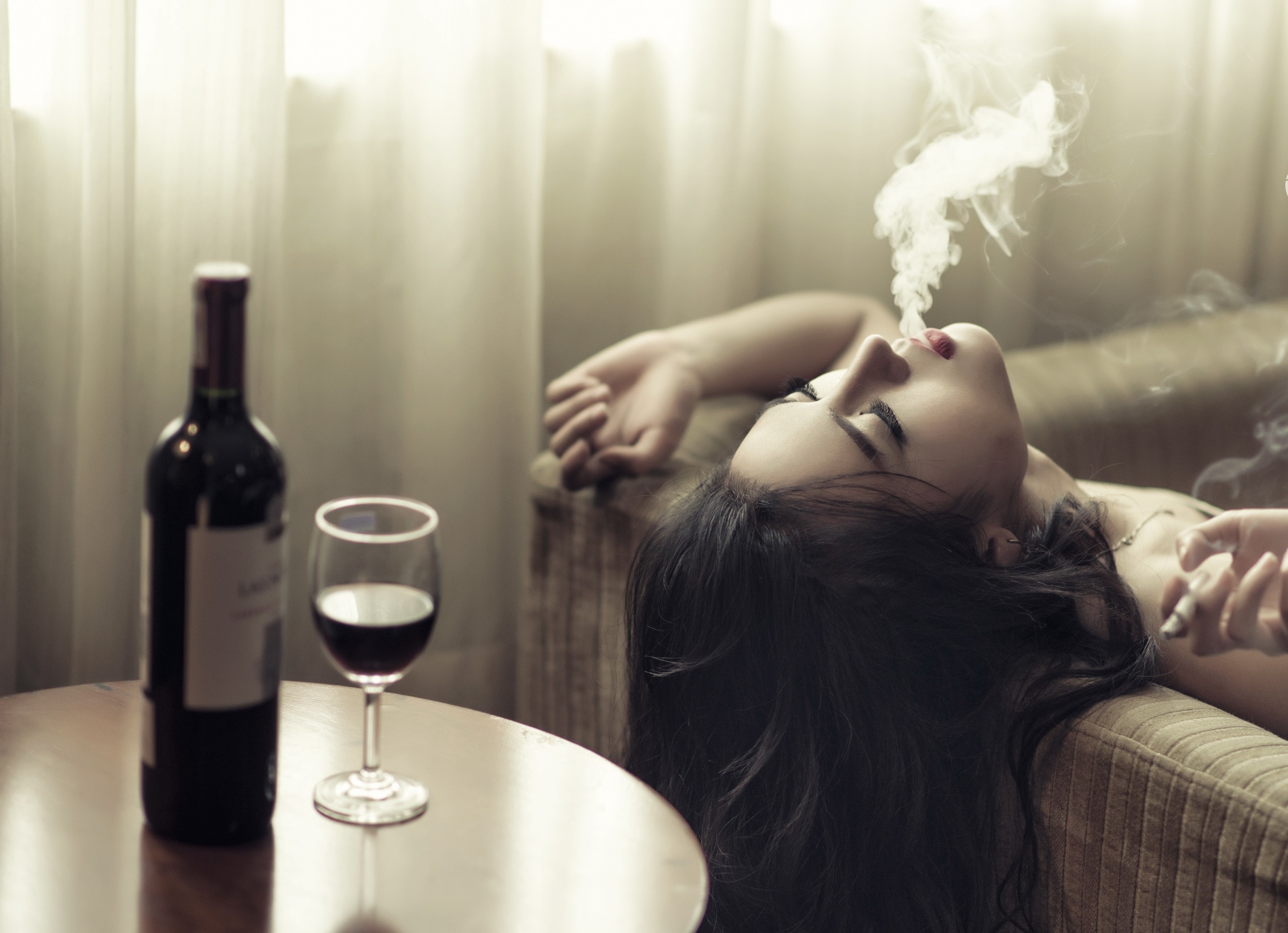 Woman smoking with wine bottle and glass HD Wallpaper