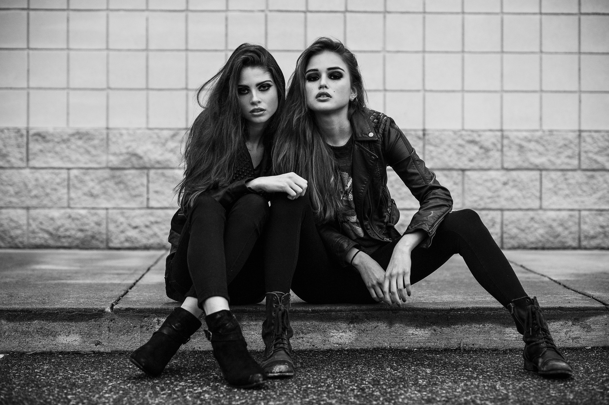 Two women with dark makeup and leather jackets HD Wallpaper