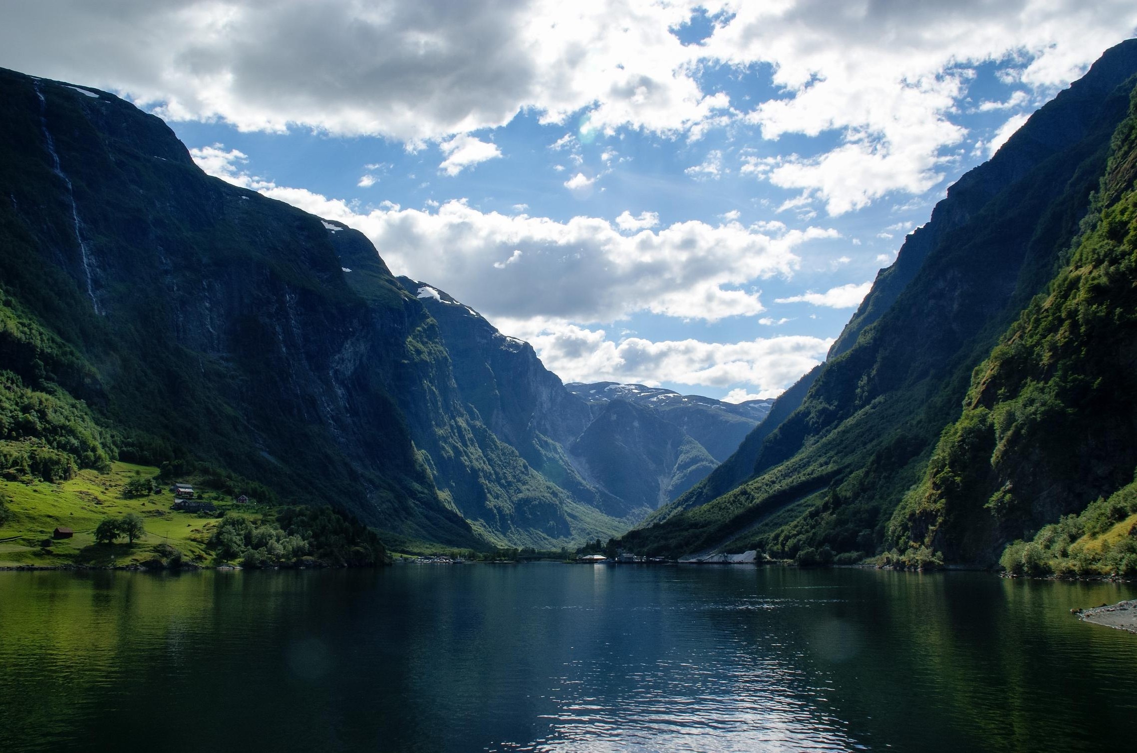 A serene fjord with mountains and clouds HD Wallpaper