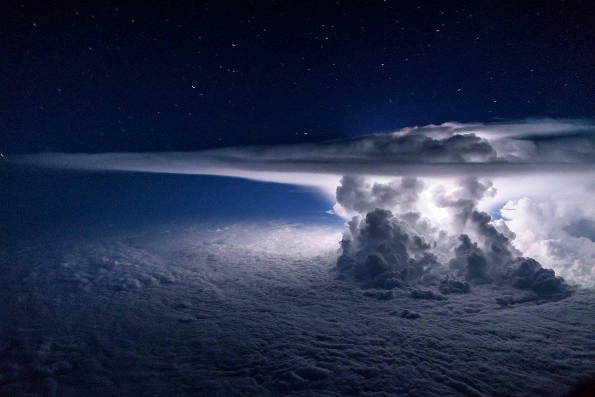 Lightning storm over clouds at night HD Wallpaper