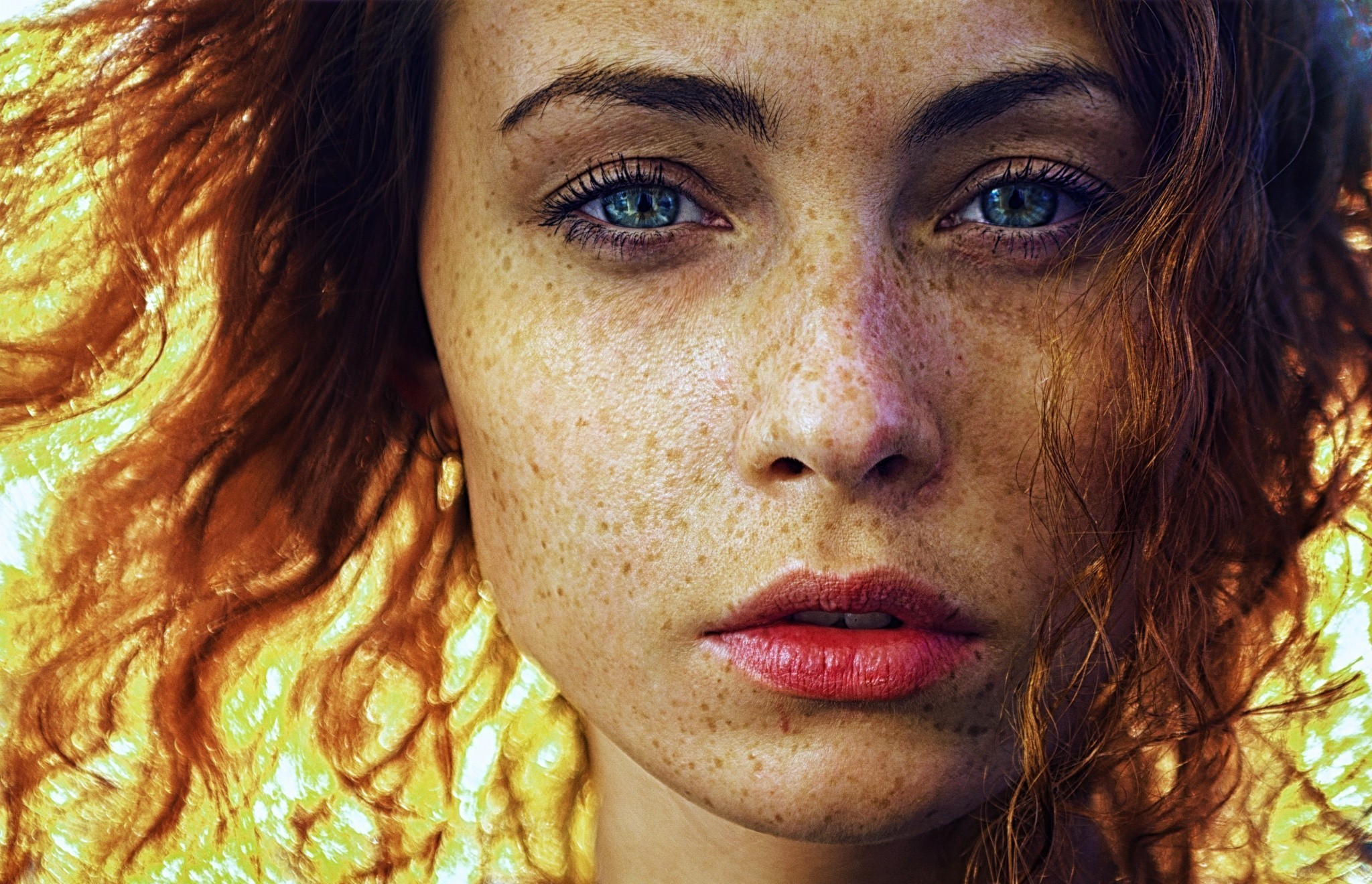 Portrait of a woman with freckles and blue eyes HD Wallpaper