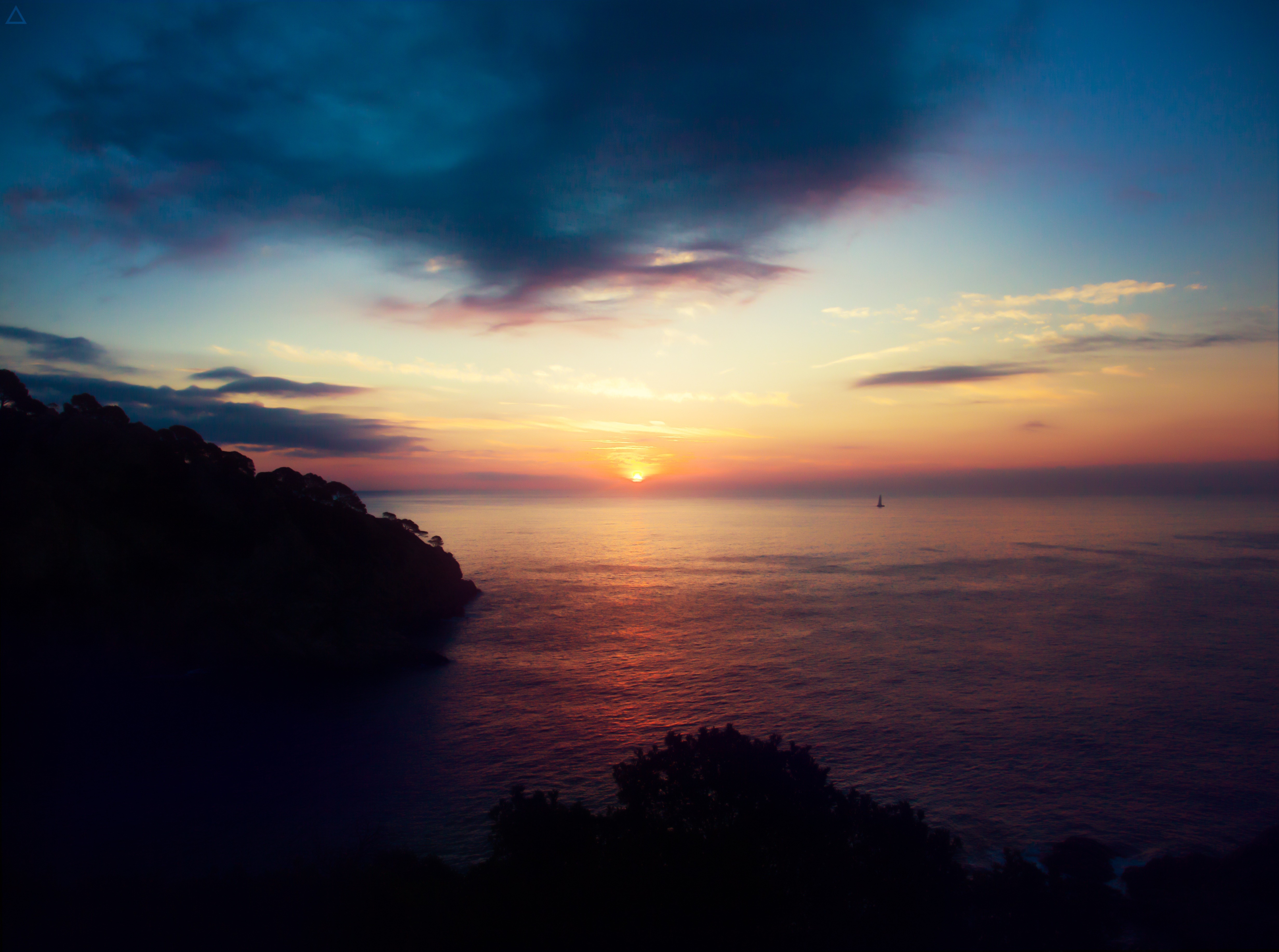 Sunset over the sea with a distant boat HD Wallpaper