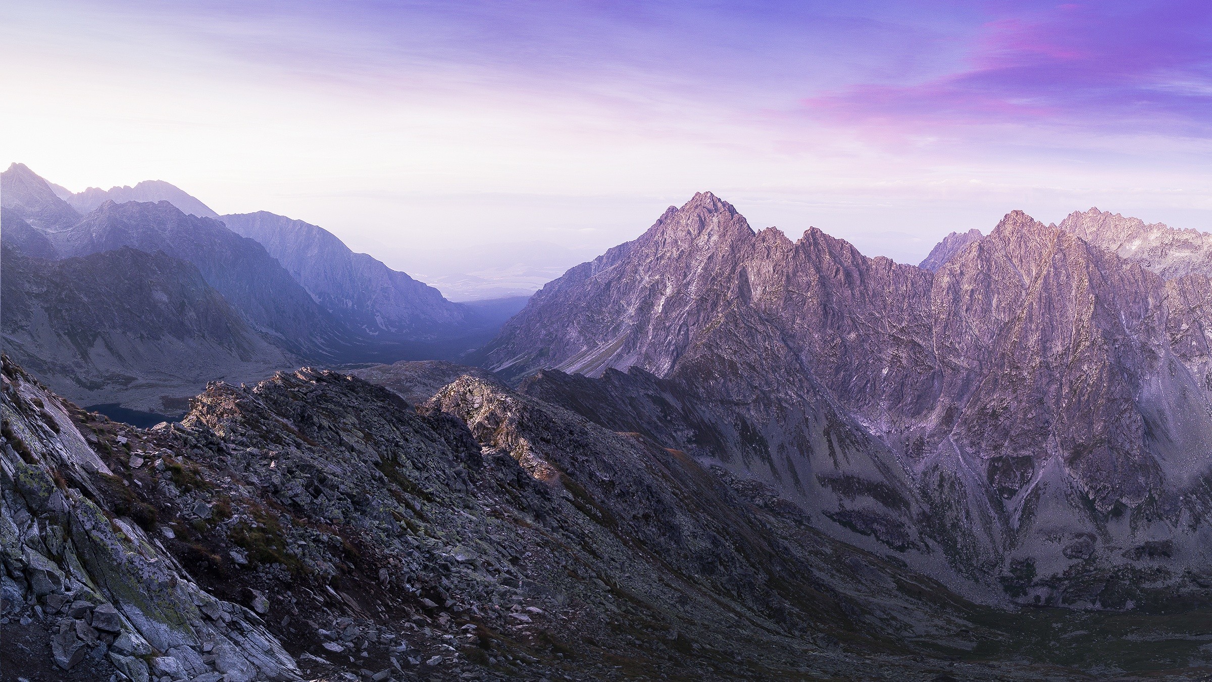Mountain range at sunset with purple sky HD Wallpaper