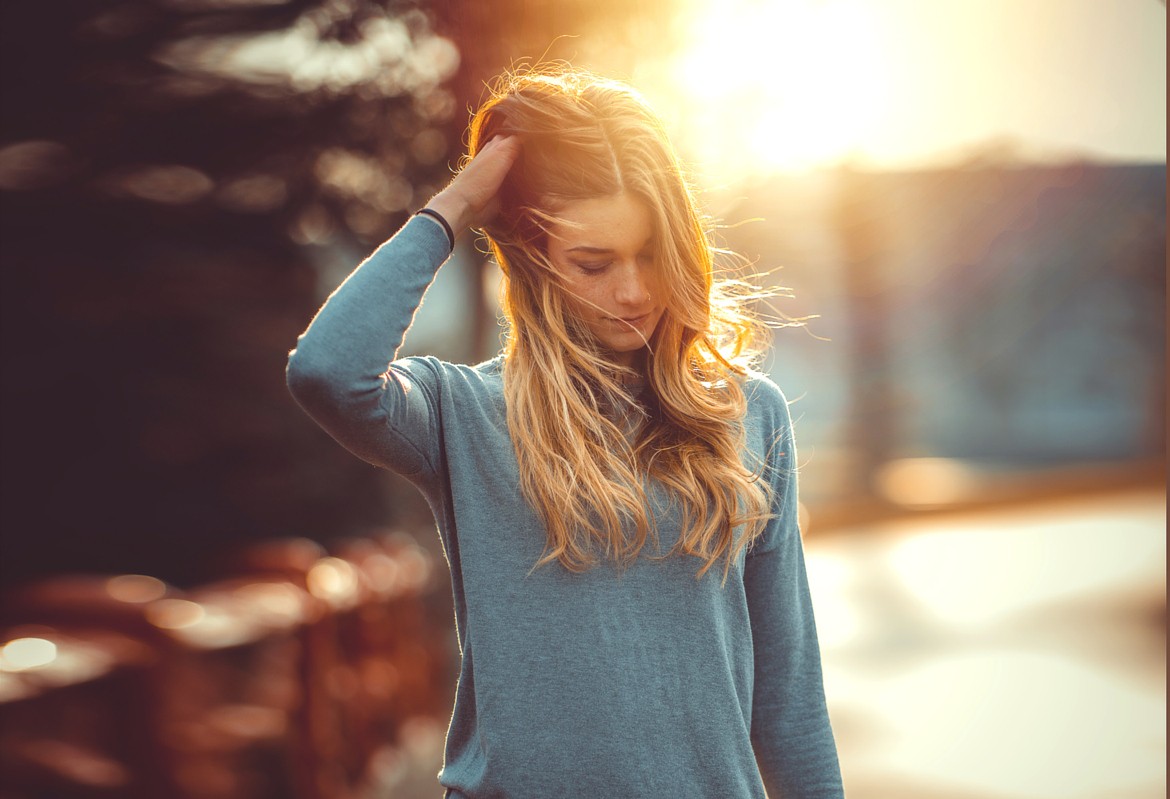 Woman with blonde hair in sunlight HD Wallpaper