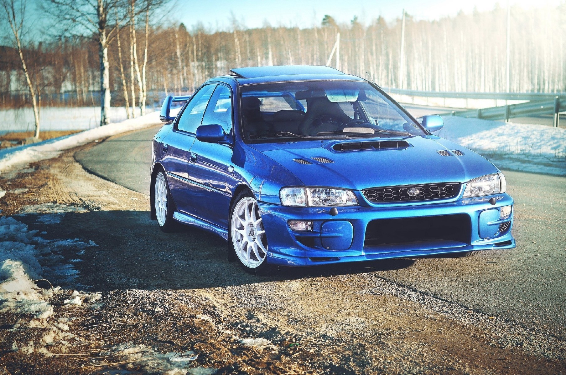 Blue Subaru Impreza WRX STI parked on a road HD Wallpaper