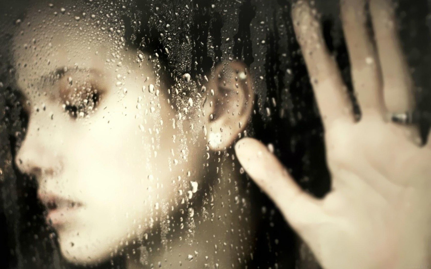 Woman's face behind a rain-covered window HD Wallpaper